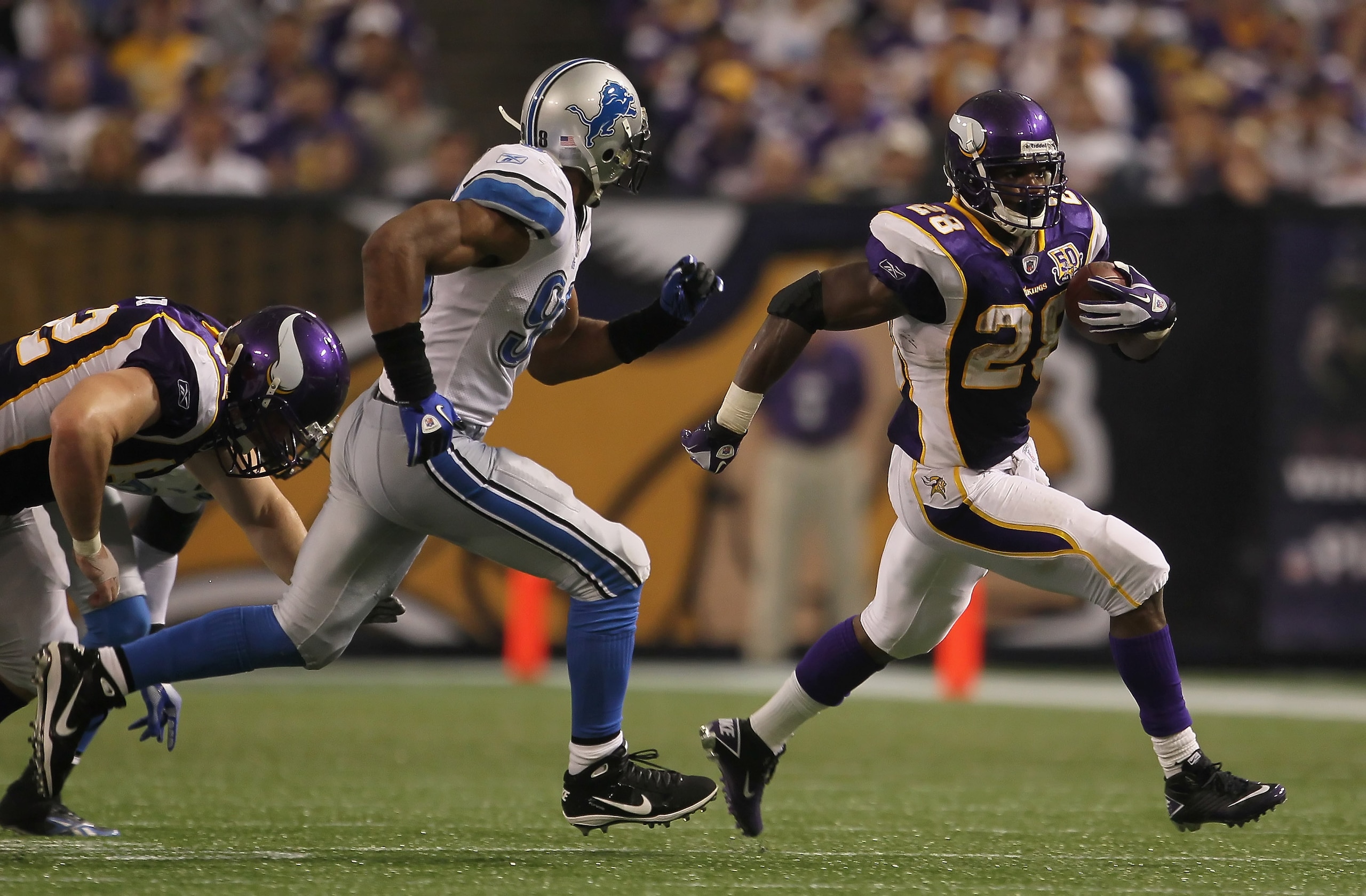 MINNEAPOLIS - SEPTEMBER 26: Running back Adrian Peterson #28 of the Minnesota Vikings carries the ball while being pursued by Julian Peterson #98 of the Detroit Lions during the second half at Hubert H. Humphrey Metrodome on September 26, 2010 in Minneap MINNEAPOLIS - SEPTEMBER 26: Running back Adrian Peterson #28 of the Minnesota Vikings carries the ball while being pursued by Julian Peterson #98 of the Detroit Lions during the second half at Hubert H. Humphrey Metrodome on September 26, 2010 in Minneap