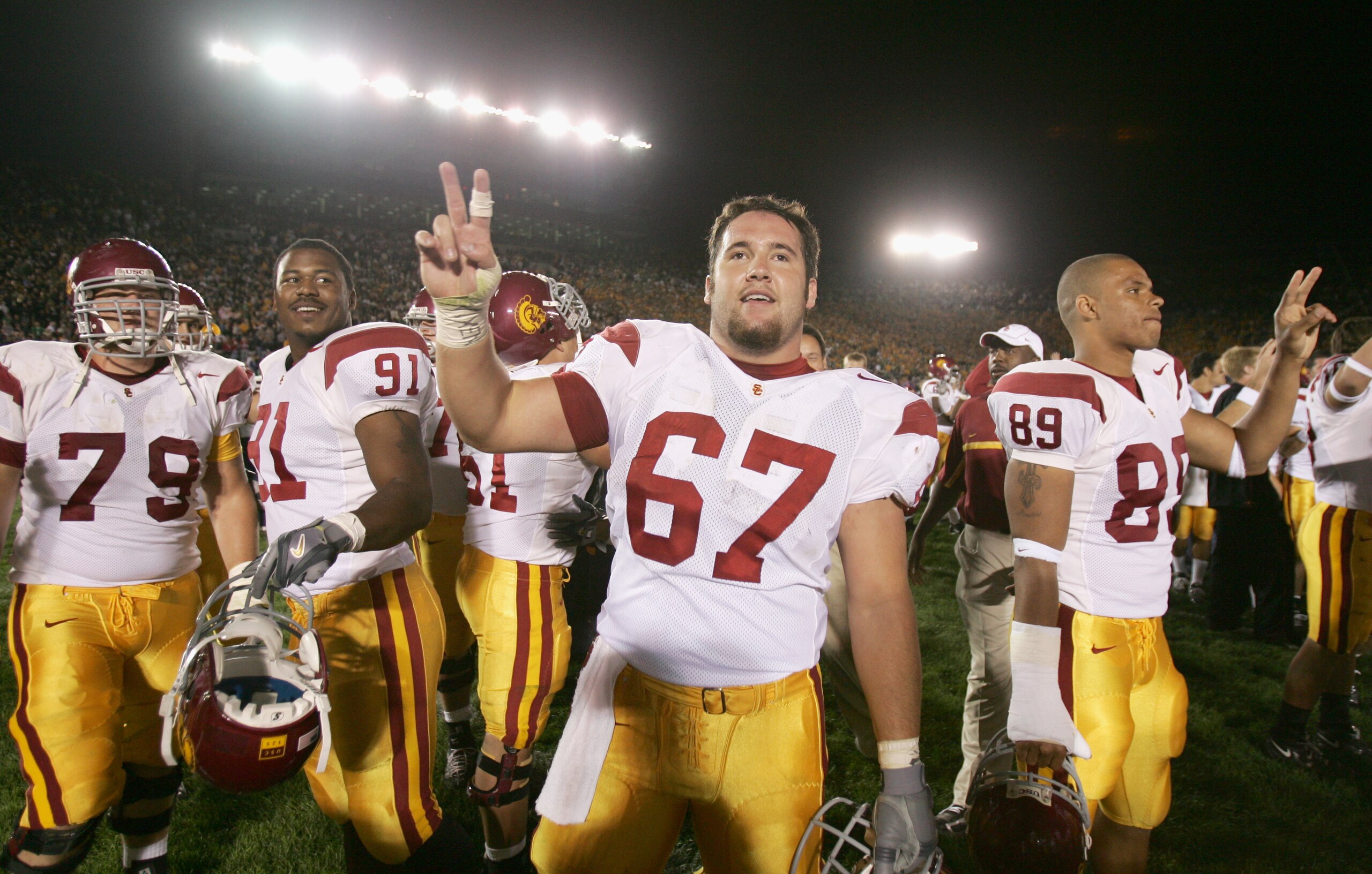 SOUTH BEND, IN - OCTOBER 15:  Center Ryan Kalil #67 of the University of Southern California Trojans gives the 'V' for victory during the game against the University of Notre Dame Fighting Irish on October 15, 2005 at Notre Dame Stadium in South Bend, Ind
