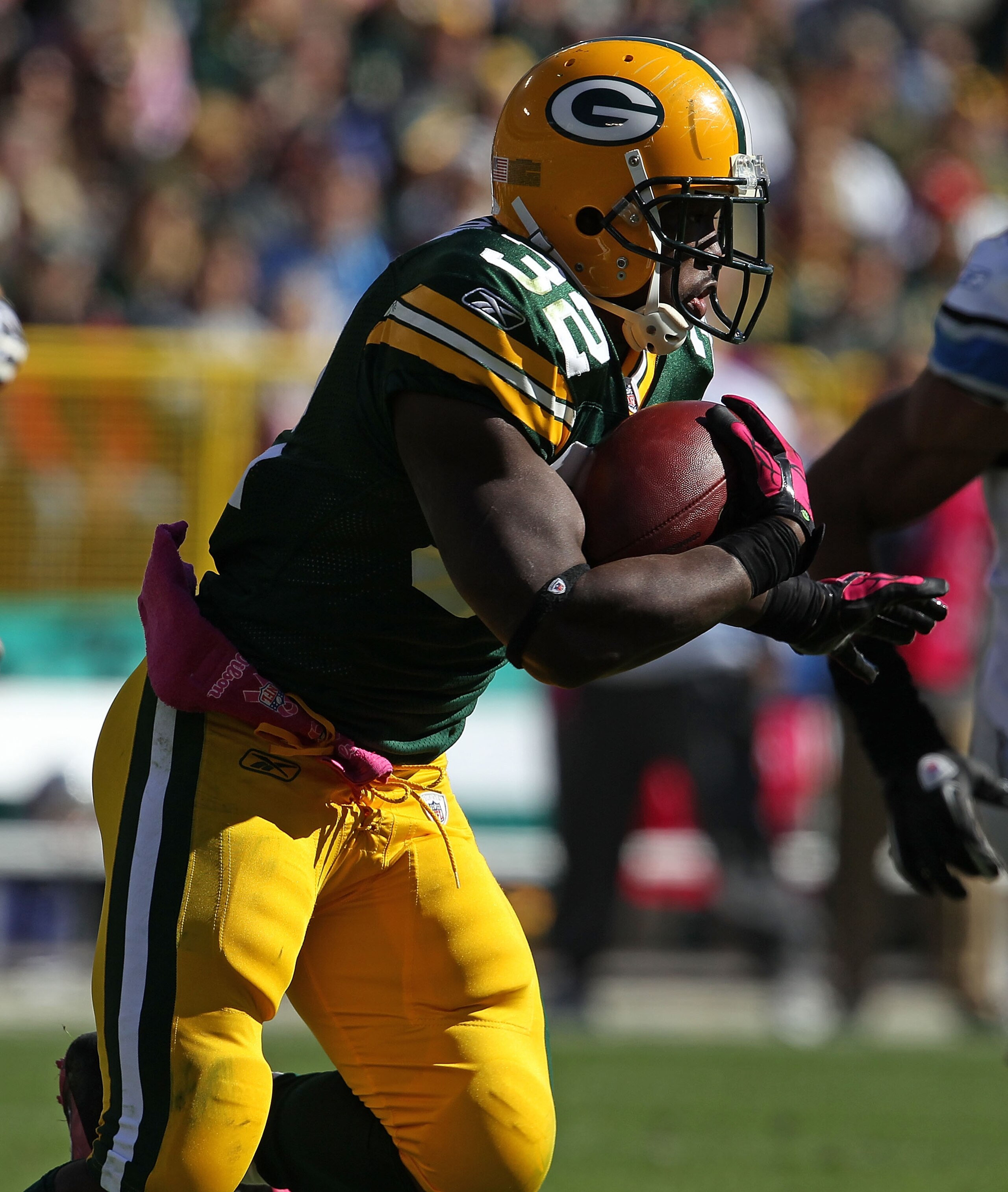 GREEN BAY, WI - OCTOBER 03: Brandon Jackson #32 of the Green Bay Packers rushes against the Detroit Lions at Lambeau Field on October 3, 2010 in Green Bay, Wisconsin. The Packers defeated the Lions 28-26. (Photo by Jonathan Daniel/Getty Images)