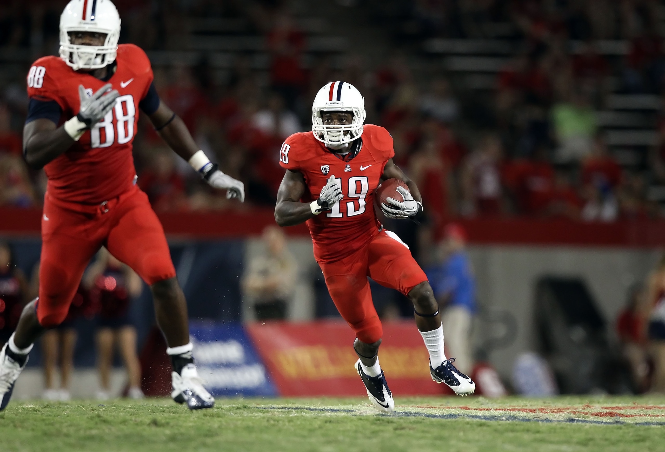TUCSON, AZ - SEPTEMBER 25:  Wide receiver William Wright #19 of the Arizona Wildcats runs with the football during the college football game against the California Golden Bears at Arizona Stadium on September 25, 2010 in Tucson, Arizona.   The Wildcats de
