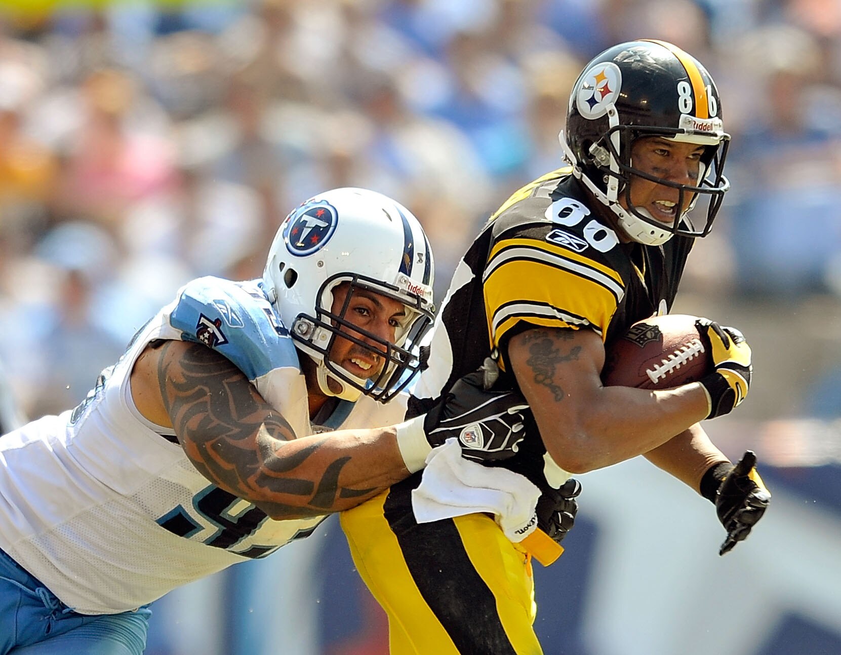 NASHVILLE, TN - SEPTEMBER 19:  Hines Ward #86 of the Pittsburgh Steelers makes a catch under pressure from Jason Babin #93 of the Tennessee Titans  during the first half at LP Field on September 19, 2010 in Nashville, Tennessee.  (Photo by Grant Halverson
