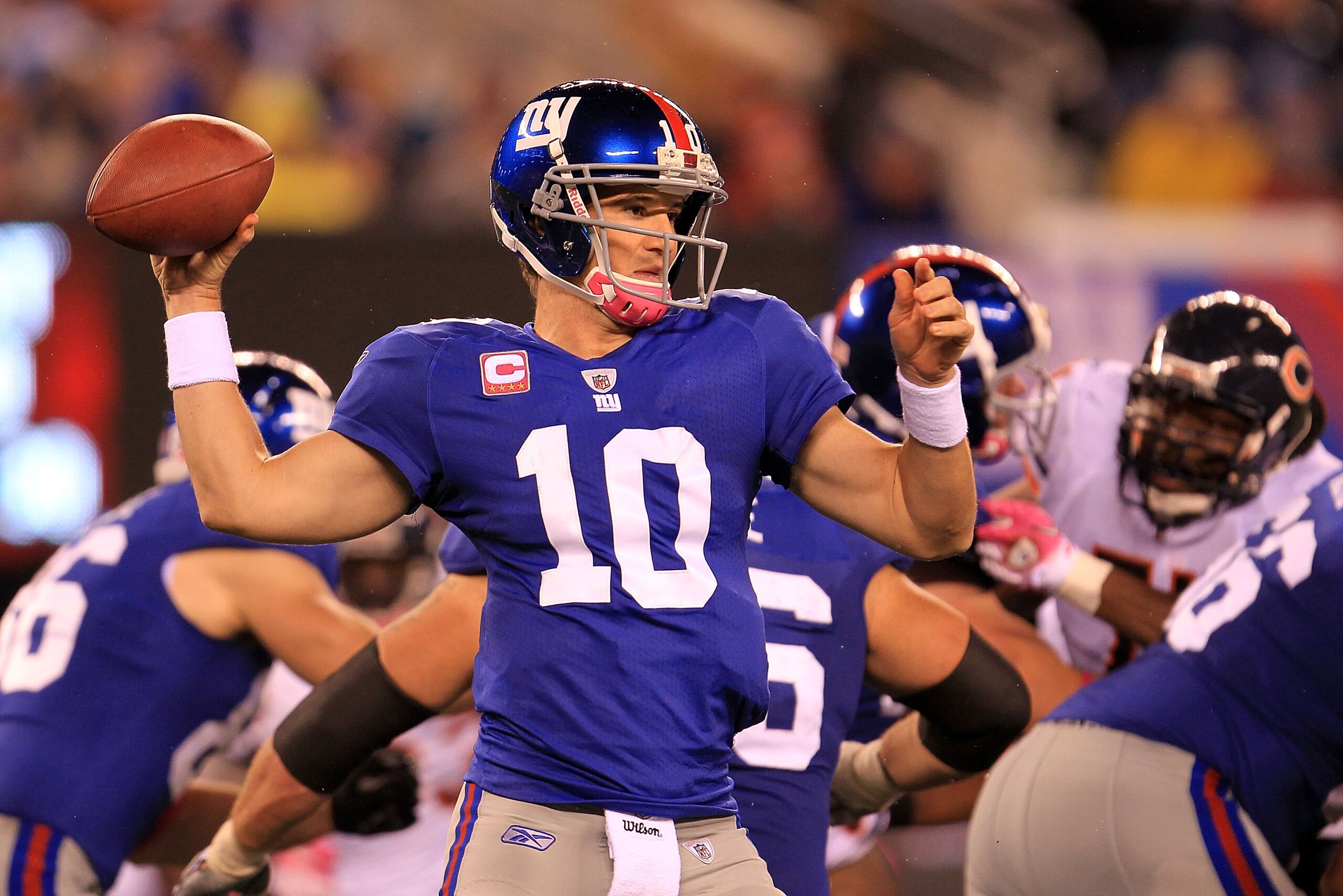 EAST RUTHERFORD, NJ - OCTOBER 03:  Eli Manning #10 of the New York Giants drops back against the Chicago Bears at New Meadowlands Stadium on October 3, 2010 in East Rutherford, New Jersey.  (Photo by Chris McGrath/Getty Images)