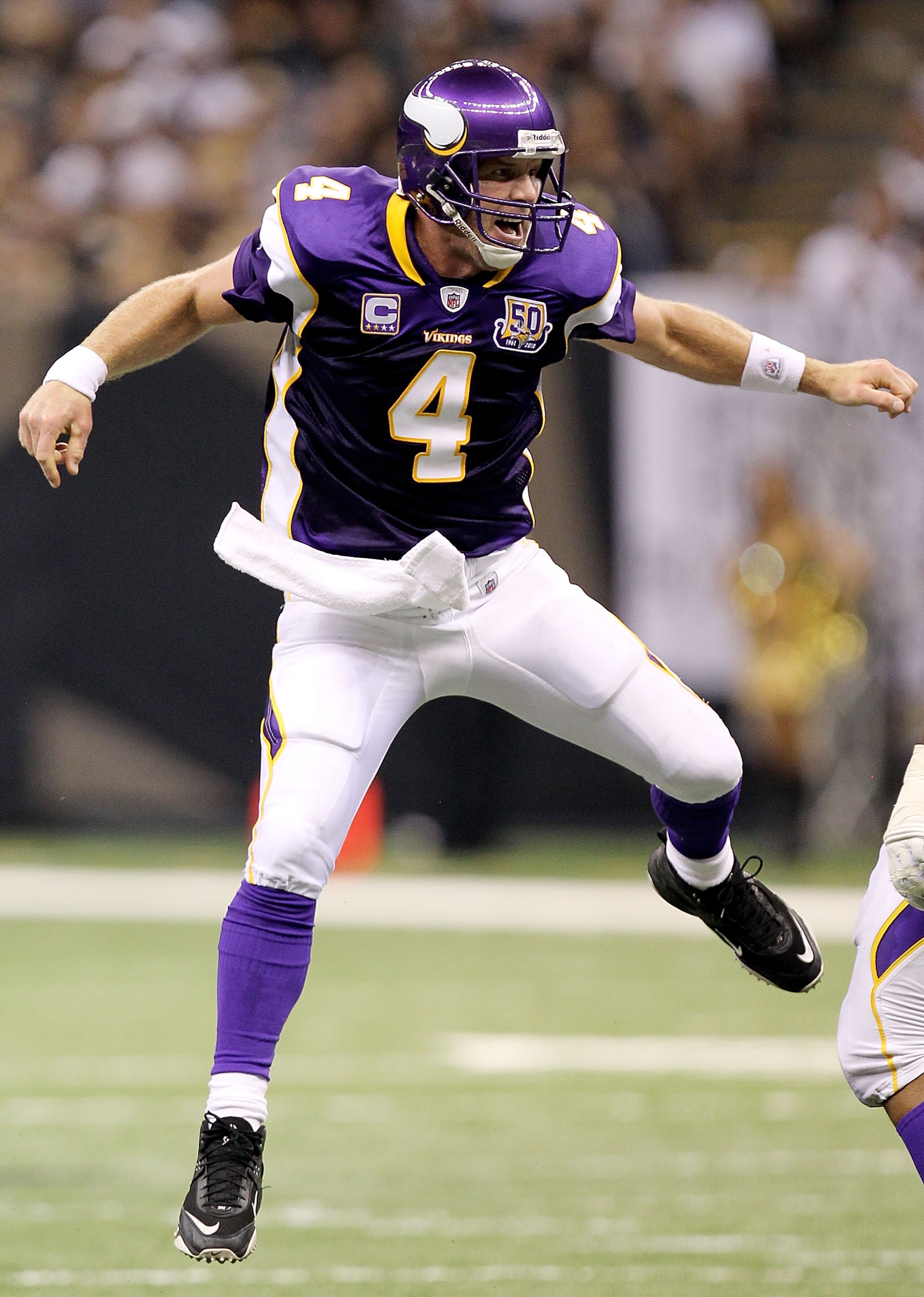 NEW ORLEANS - SEPTEMBER 09:  Quarterback Brett Favre #4 of the Minnesota Vikings celebrates a touchdown pass in the second quarter against the New Orleans Saints at Louisiana Superdome on September 9, 2010 in New Orleans, Louisiana.  (Photo by Ronald Mart