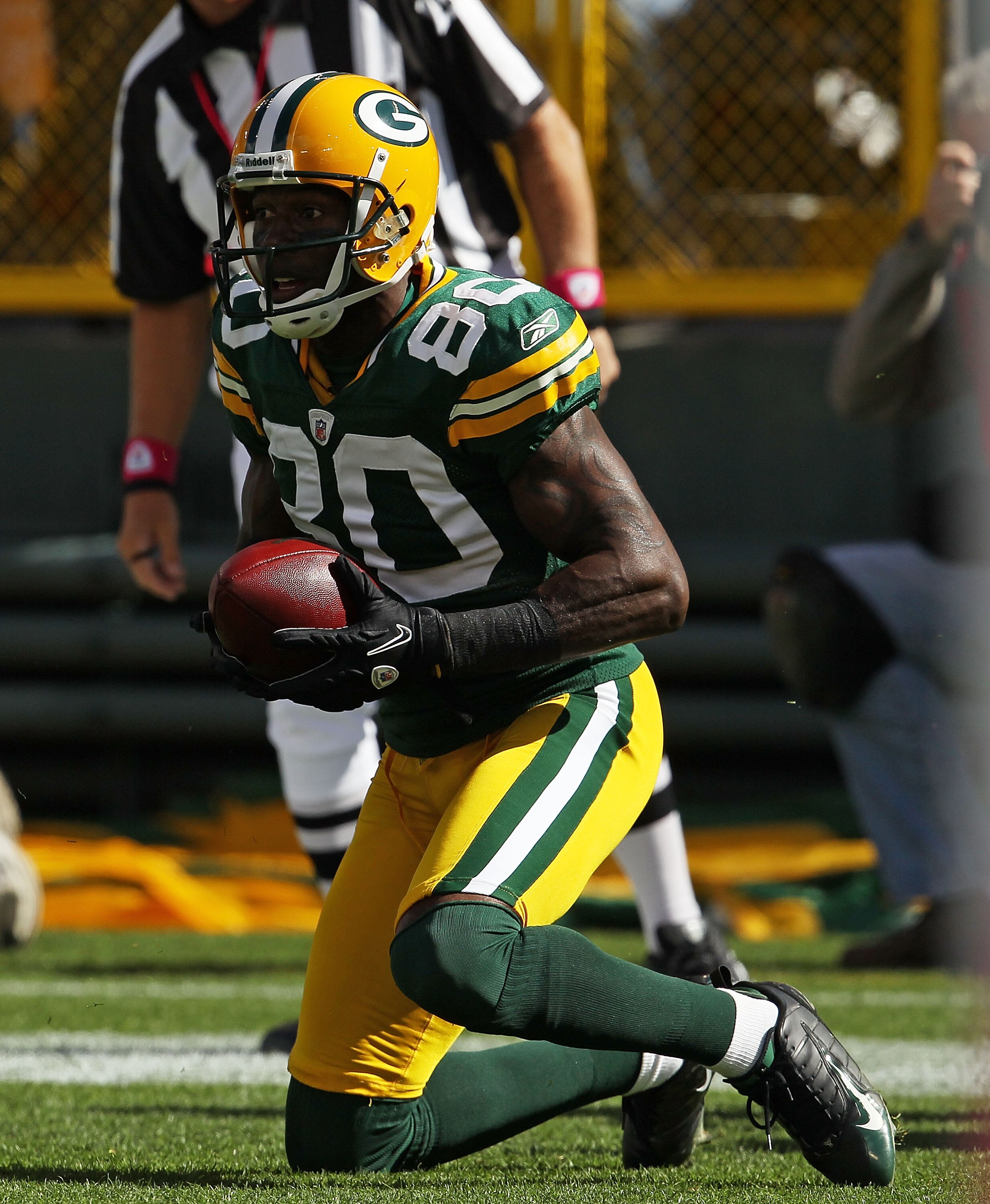GREEN BAY, WI - OCTOBER 03: Donald Driver #80 of the Green Bay Packers pops up after catching a touchdown pass against the Detroit Lions at Lambeau Field on October 3, 2010 in Green Bay, Wisconsin. The Packers defeated the Lions 28-26. (Photo by Jonathan