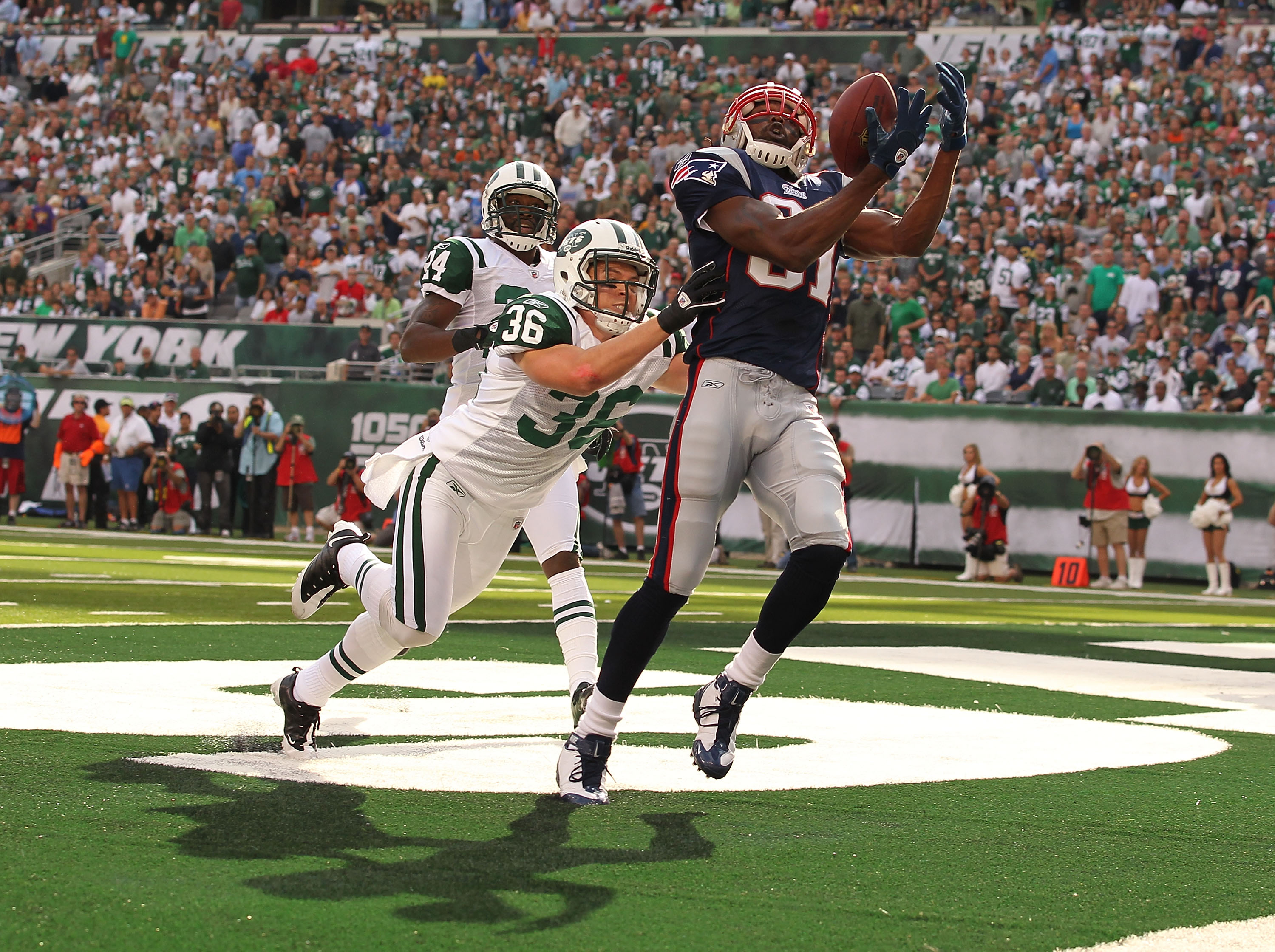 EAST RUTHERFORD, NJ - SEPTEMBER 19:  Jim Leonhard #36 of the New York Jets defends against Randy Moss #81 of the New England Patriots on September 19, 2010 at the New Meadowlands Stadium  in East Rutherford, New Jersey. There was no touchdown on the play.