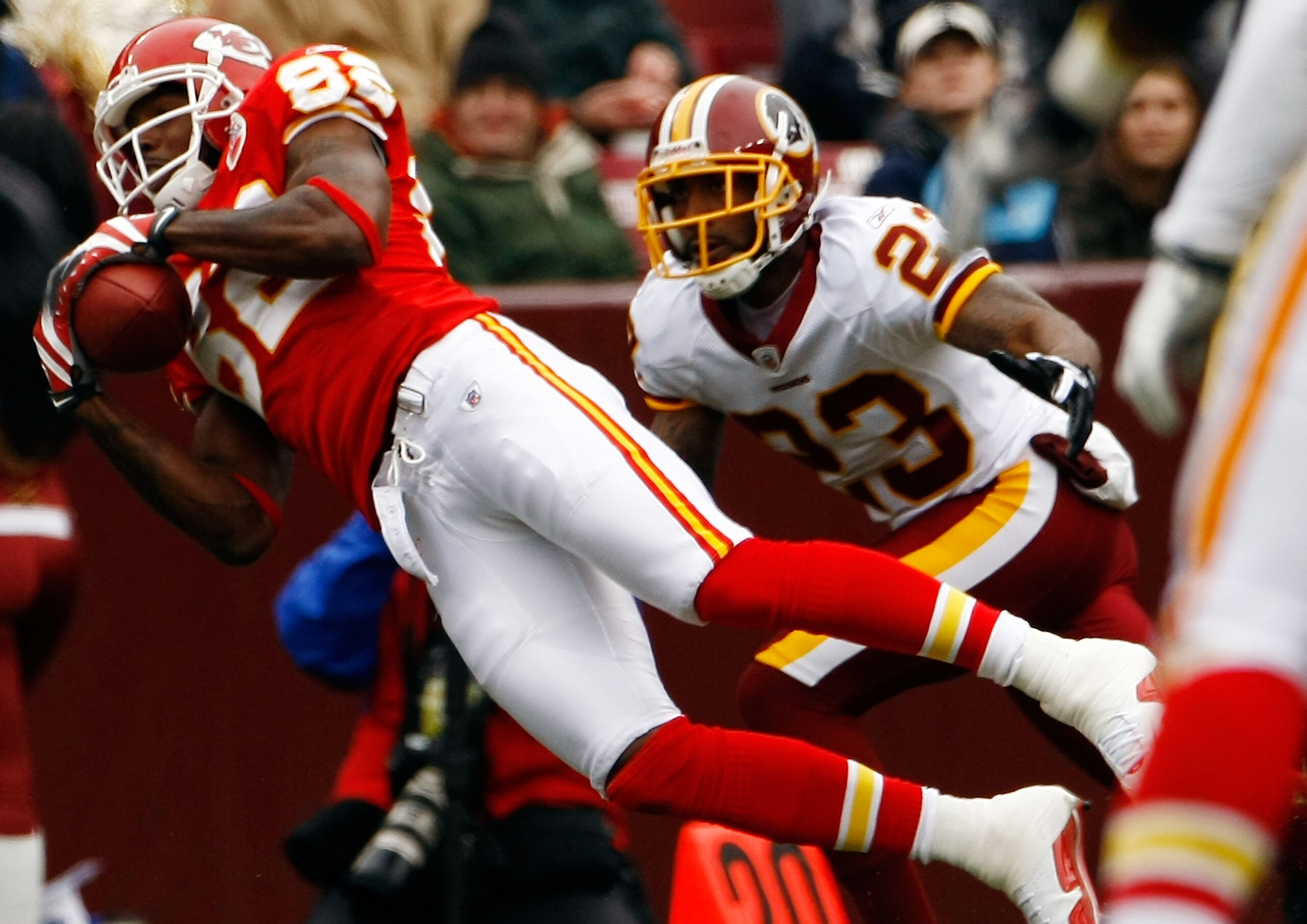 LANDOVER, MD - OCTOBER 18:  Dwayne Bowe #82 of the Kansas City Chiefs catches a pass as DeAngelo Hall #23 of the Washington Redskins defends during their game October 18, 2009 at FedEx Field in Landover, Maryland.The Chiefs won the game 14-6.  (Photo by W