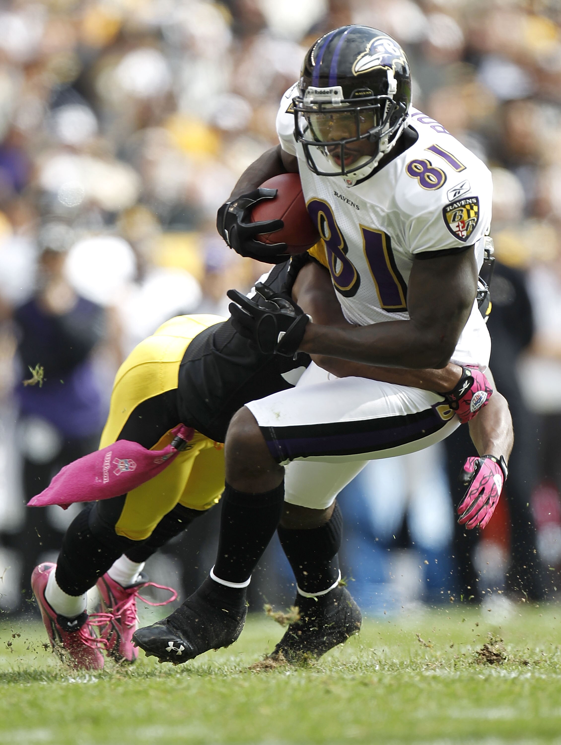 PITTSBURGH - OCTOBER 03:  Anquan Boldin #81 of the Baltimore Ravens looks for yards after the catch next to Ryan Clark #25 of the Pittsburgh Steelers on October 3, 2010 at Heinz Field in Pittsburgh, Pennsylvania.  (Photo by Gregory Shamus/Getty Images)