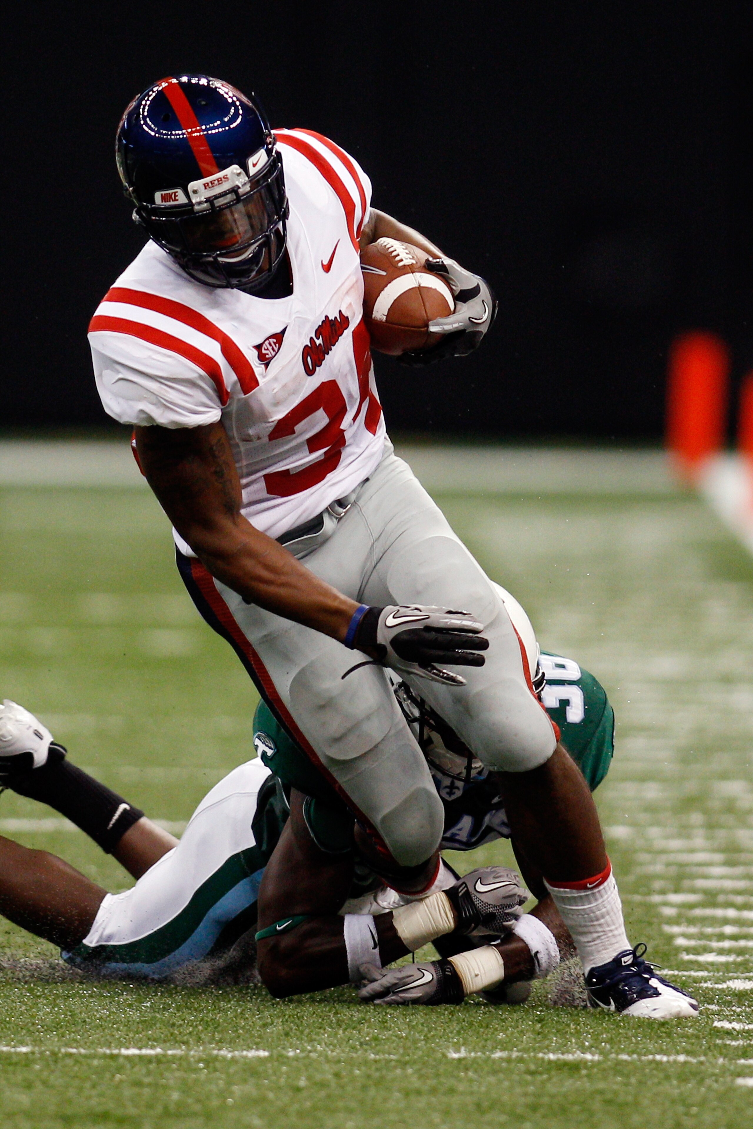 NEW ORLEANS - SEPTEMBER 11: Brandon Bolden #34 of the Ole Miss Rebels is chased by Dominique Robertson #36 of the Tulane Green Wave at the Louisiana Superdome on September 11, 2010 in New Orleans, Louisiana. (Photo by Chris Graythen/Getty Images) NEW ORLEANS - SEPTEMBER 11: Brandon Bolden #34 of the Ole Miss Rebels is chased by Dominique Robertson #36 of the Tulane Green Wave at the Louisiana Superdome on September 11, 2010 in New Orleans, Louisiana. (Photo by Chris Graythen/Getty Images)