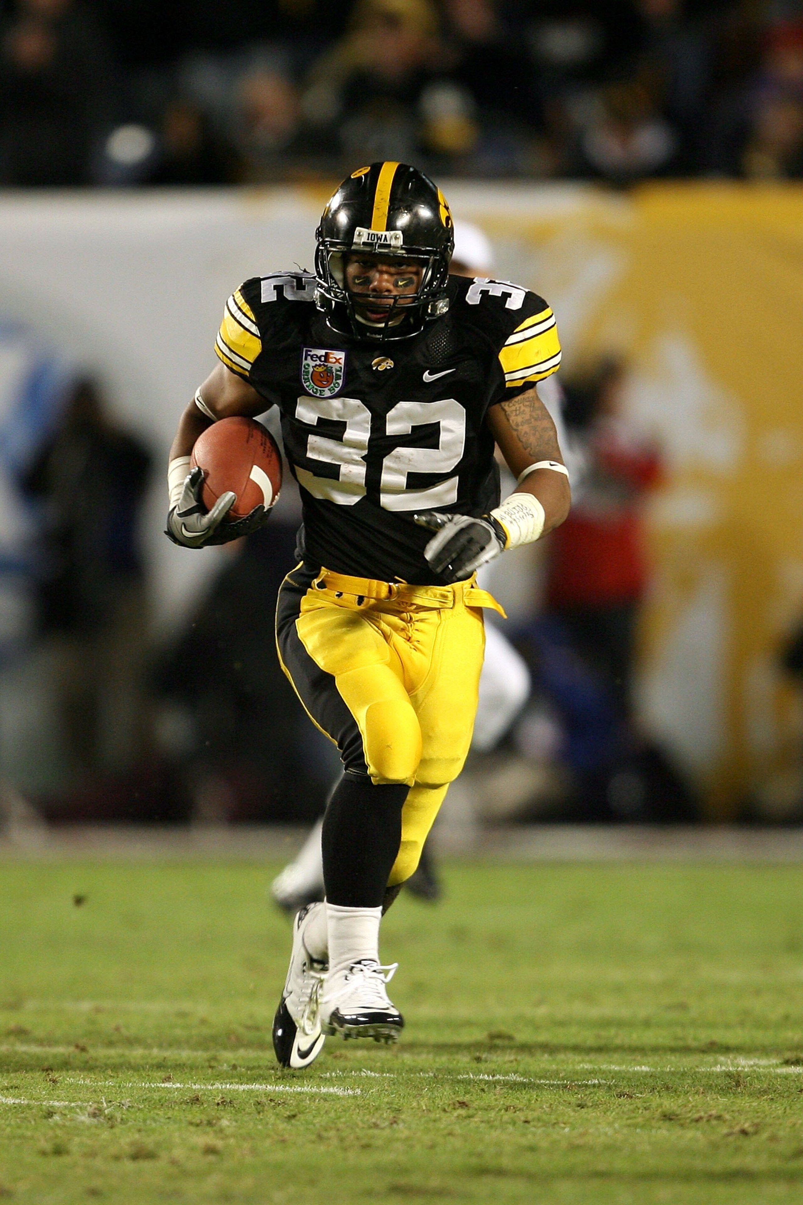 MIAMI GARDENS, FL - JANUARY 05: Adam Robinson #32 of the Iowa Hawkeyes runs the ball against the Georgia Tech Yellow Jackets during the FedEx Orange Bowl at Land Shark Stadium on January 5, 2010 in Miami Gardens, Florida. Iowa won 24-14. (Photo by Doug B MIAMI GARDENS, FL - JANUARY 05: Adam Robinson #32 of the Iowa Hawkeyes runs the ball against the Georgia Tech Yellow Jackets during the FedEx Orange Bowl at Land Shark Stadium on January 5, 2010 in Miami Gardens, Florida. Iowa won 24-14. (Photo by Doug B
