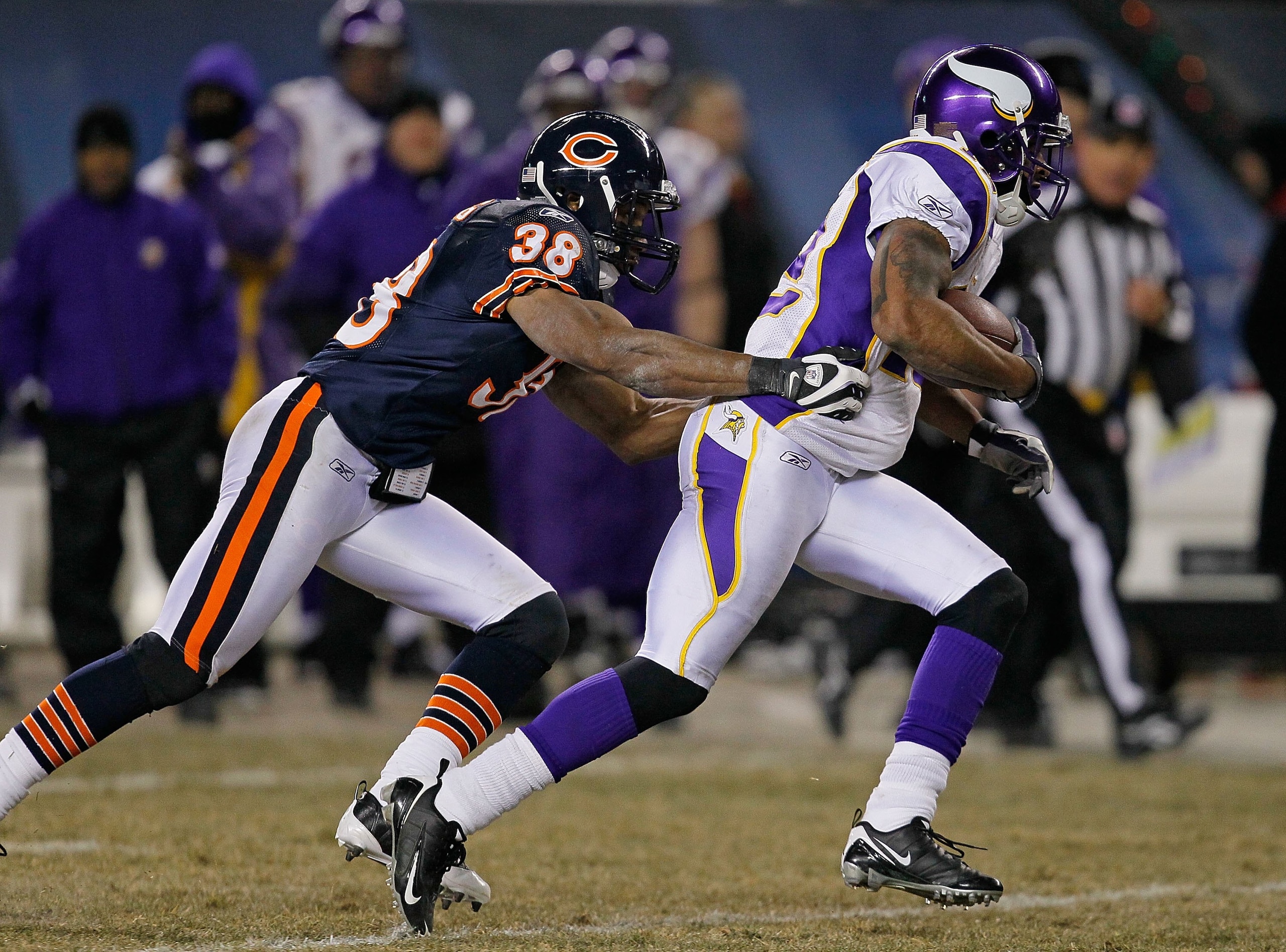 CHICAGO - DECEMBER 28: Percy Harvin #12 of the Minnesota Vikings is chased by Danieal Manning #38 of the Chicago Bears at Soldier Field on December 28, 2009 in Chicago, Illinois. The Bears defeated the Vikings 36-30 in overtime. (Photo by Jonathan Daniel/