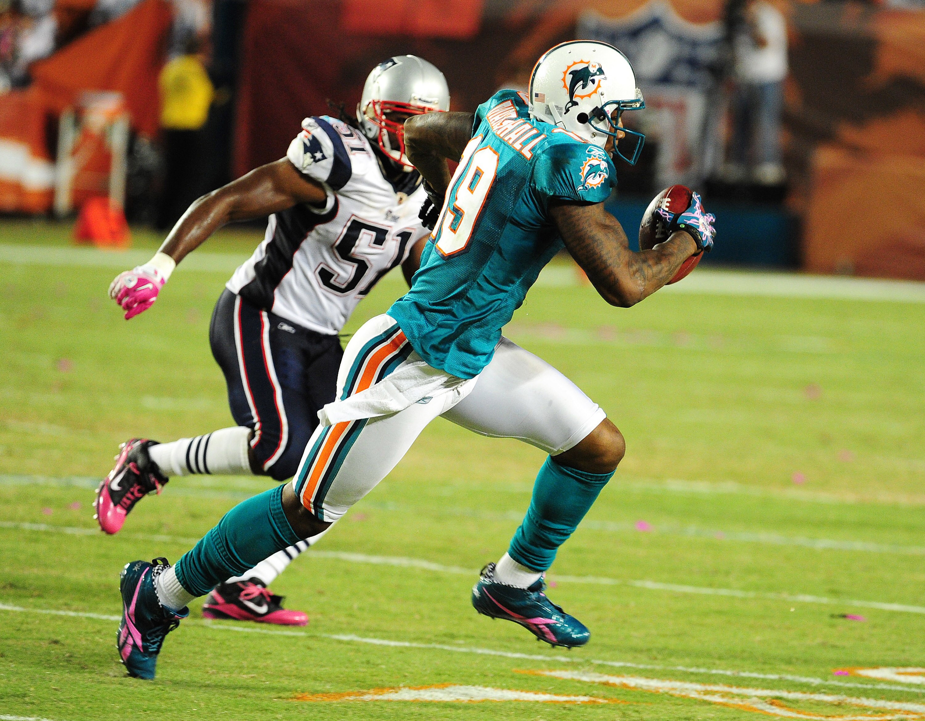 MIAMI - OCTOBER 4: Brandon Marshall #19 of the Miami Dolphins runs with a catch against the New England Patriots at Sun Life Field on October 4, 2010 in Miami, Florida. (Photo by Scott Cunningham/Getty Images)