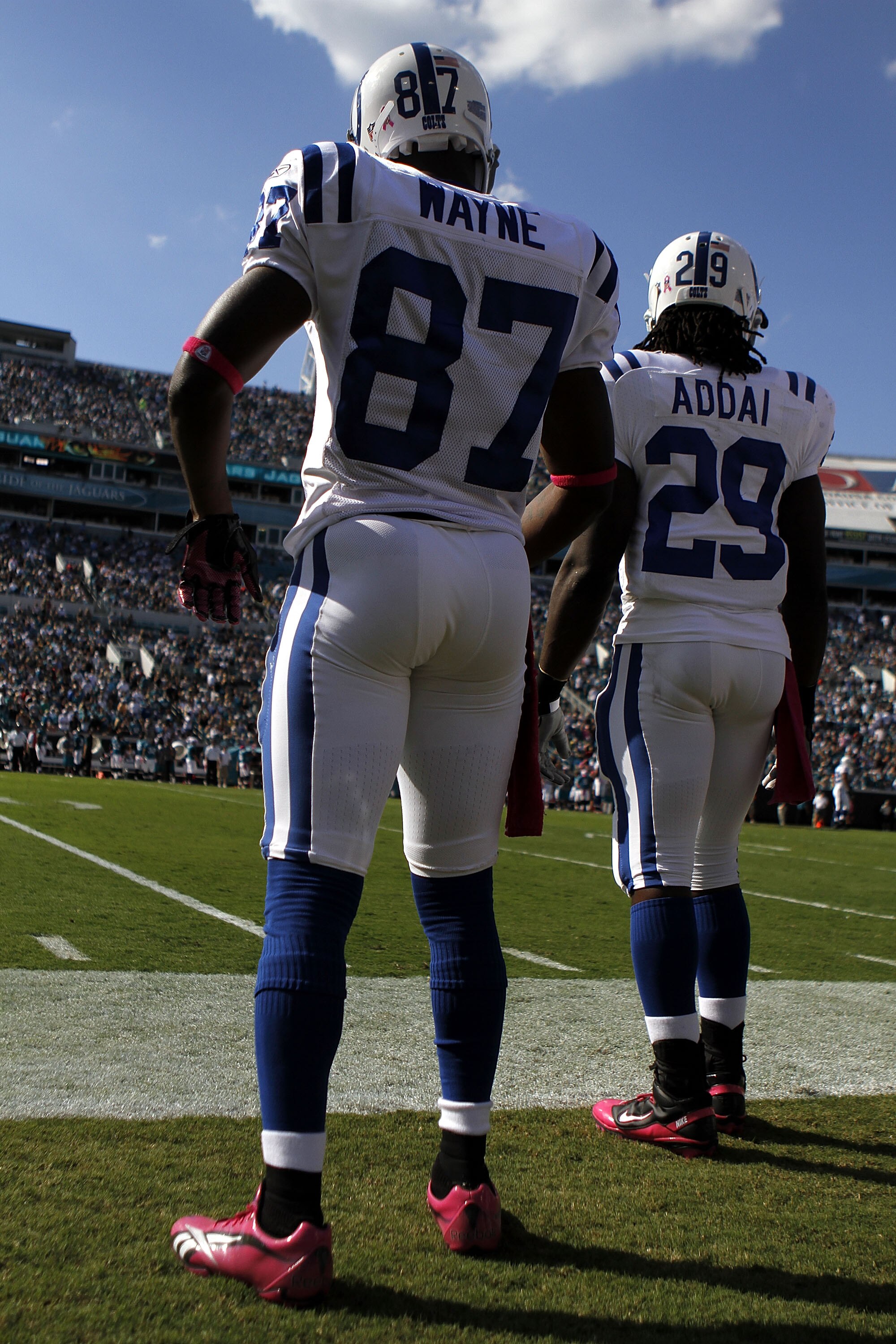 JACKSONVILLE, FL - OCTOBER 03:  Receiver Reggie Wayne #87 and Joseph Addai #29 of the Indianapolis Colts stands on the sideloines while taking on the Jacksonville Jaguars at EverBank Field on October 3, 2010 in Jacksonville, Florida. The Jaguars won 31-28