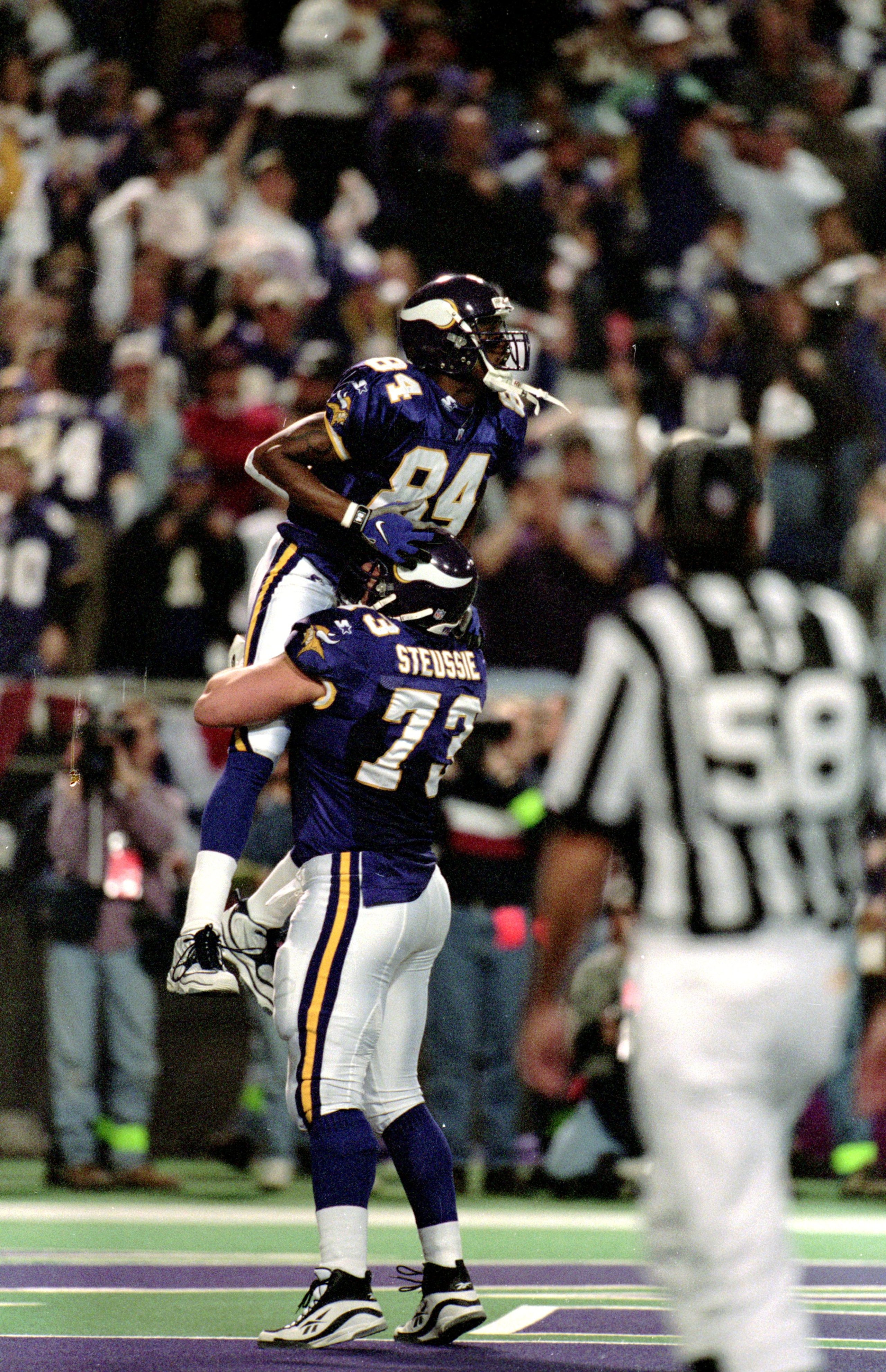 10 Jan 1999:  Randy Moss #84 of the Minnesota Vikings celebrates with teammate Todd Steussie #73 after scoring a touch down during the NFC Play Off Game against the Arizona Cardinals at the HHH Metrodome in Minneapolis, Minnesota. The Vikings defeated the