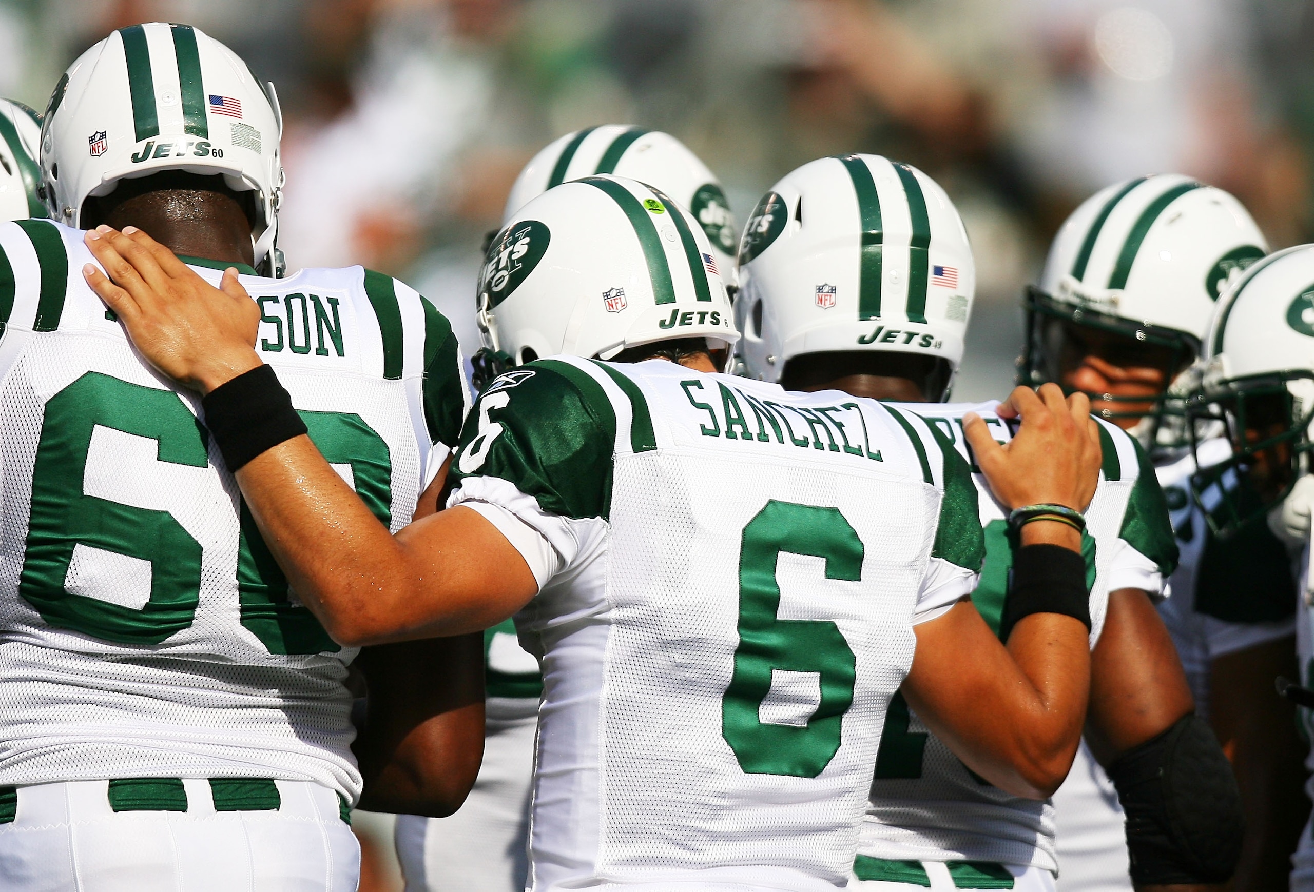 EAST RUTHERFORD, NJ - SEPTEMBER 19:  Mark Sanchez #6 of the New York Jets huddles with his team before a game against the New England Patriots at the New Meadowlands Stadium on September 19, 2010 in East Rutherford, New Jersey.  (Photo by Andrew Burton/Ge