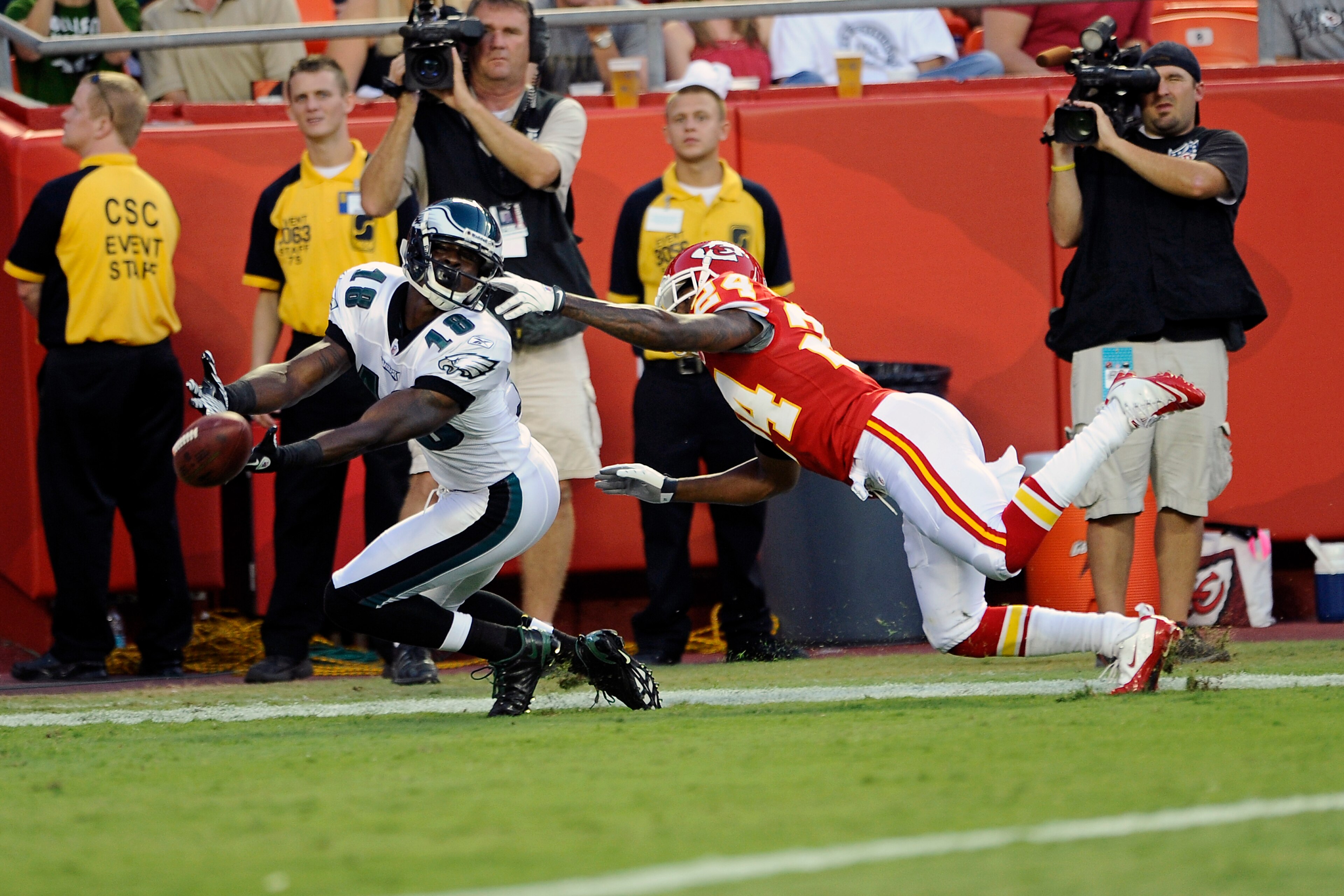 KANSAS CITY, MO - AUGUST 27: Jeremy Maclin #18 of the Philadelphia Eagles attemtps to make a reception as Brandon Flowers #24 of the Kansas City Chiefs gets a hand on his facemask at Arrowhead Stadium on August 27, 2010 in Kansas City, Missouri.  (Photo b
