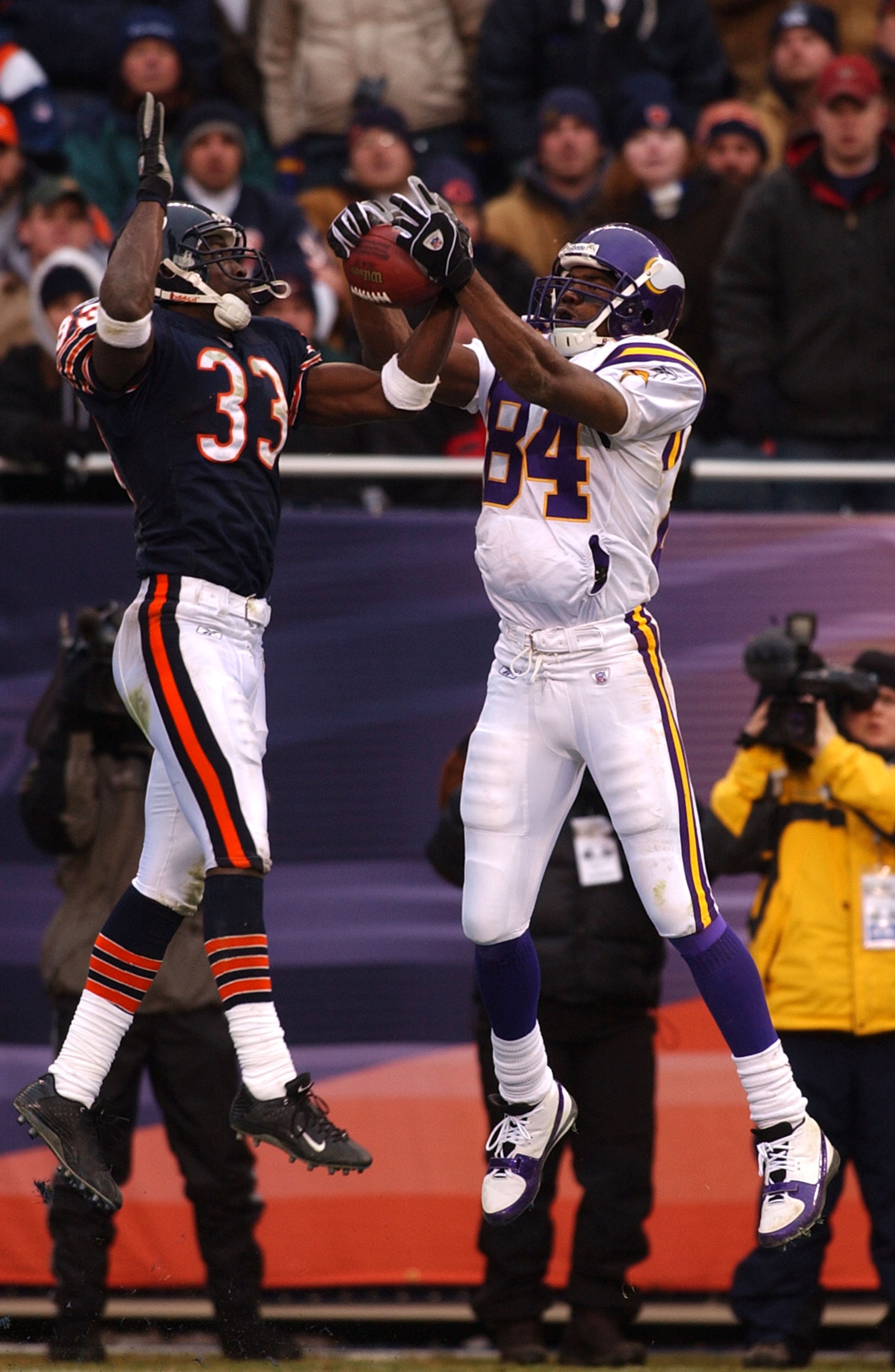 CHICAGO - DECEMBER 14: Cornerback Charles Tillman #33 of the Chicago Bears takes the ball away from receiver Randy Moss #84 of the Minnesota Vikings on a pass in the end zone during a game on December 14, 2003 at Soldier Field in Chicago, Illinois. The Be
