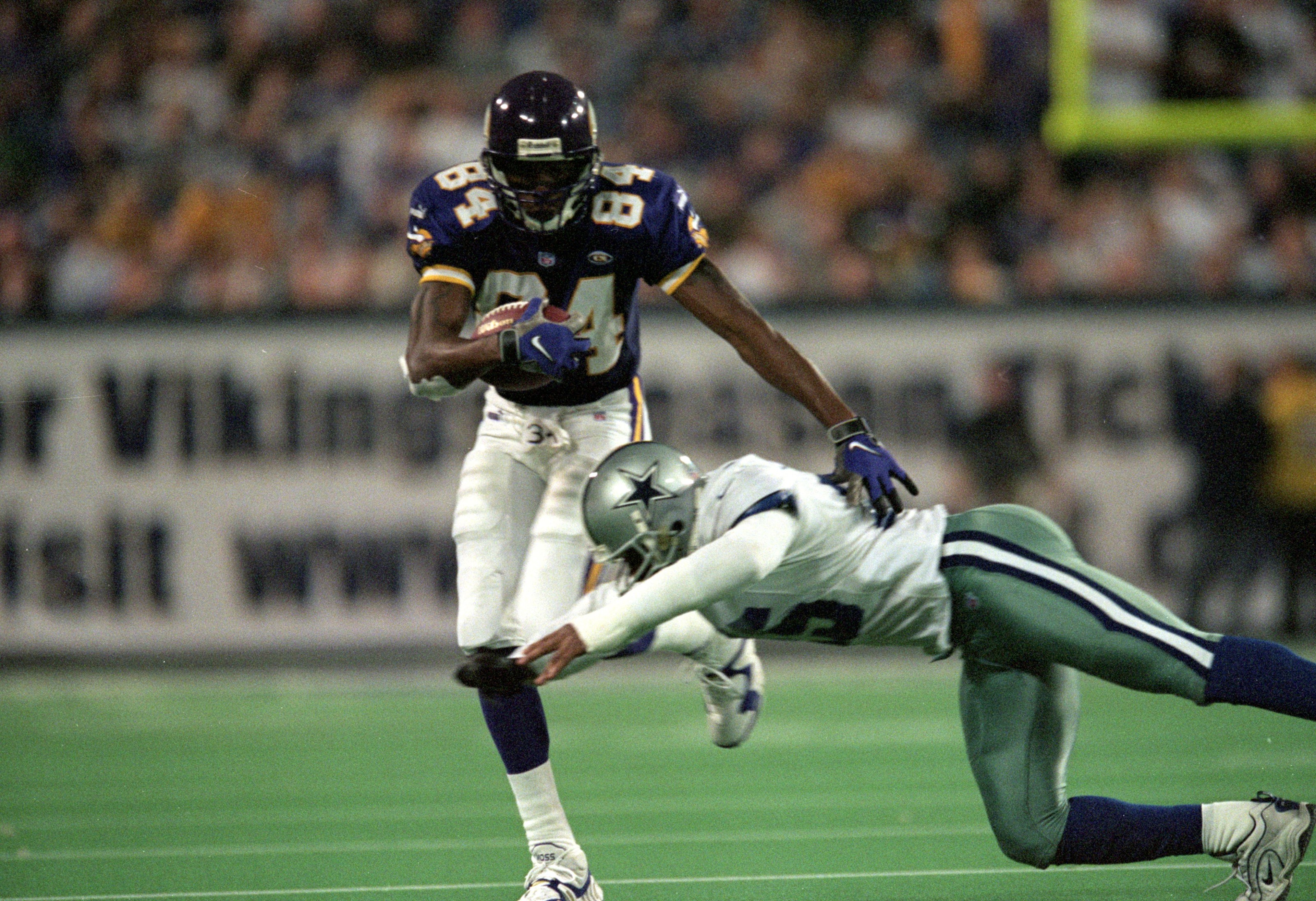 8 Nov 1999:  Randy Moss #84 of the Minnesota Vikings in action against Charlie Williams of the Dallas Cowboys at the Herbert H. Humphery Metrodome in Minneapolis, Minnesota. The Vikings defeated the Cowboys 27-17. Mandatory Credit: Elsa Hasch/Allsport