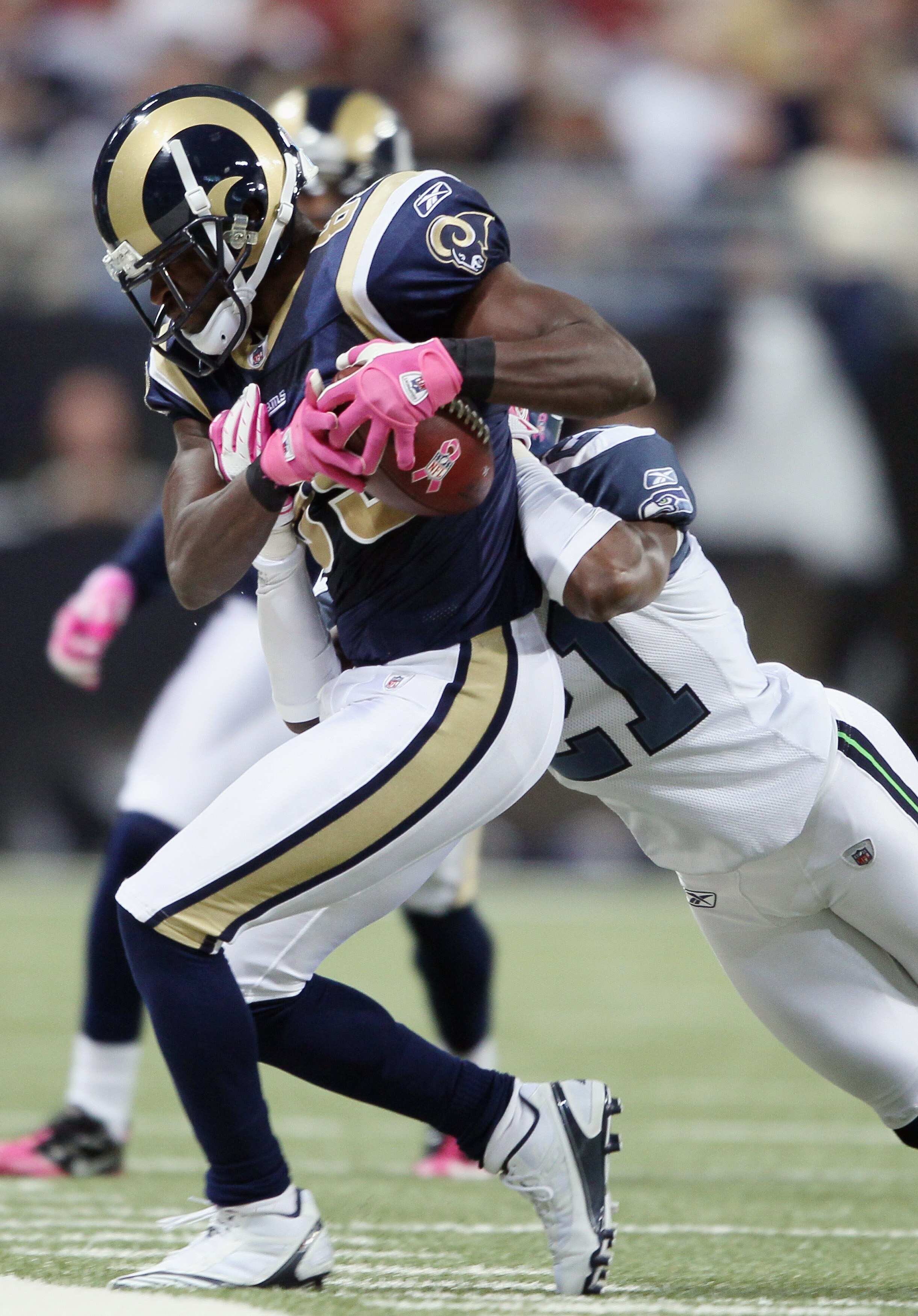 ST. LOUIS - OCTOBER 03:  Mark Clayton #89 of the St. Louis Rams makes the catch as Kelly Jennings #21 of the Seattle Seahawks defends on October 3, 2010 at Edward Jones Dome in St. Louis, Missouri. The Rams defeated the Seahawks 20-3.  (Photo by Elsa/Gett