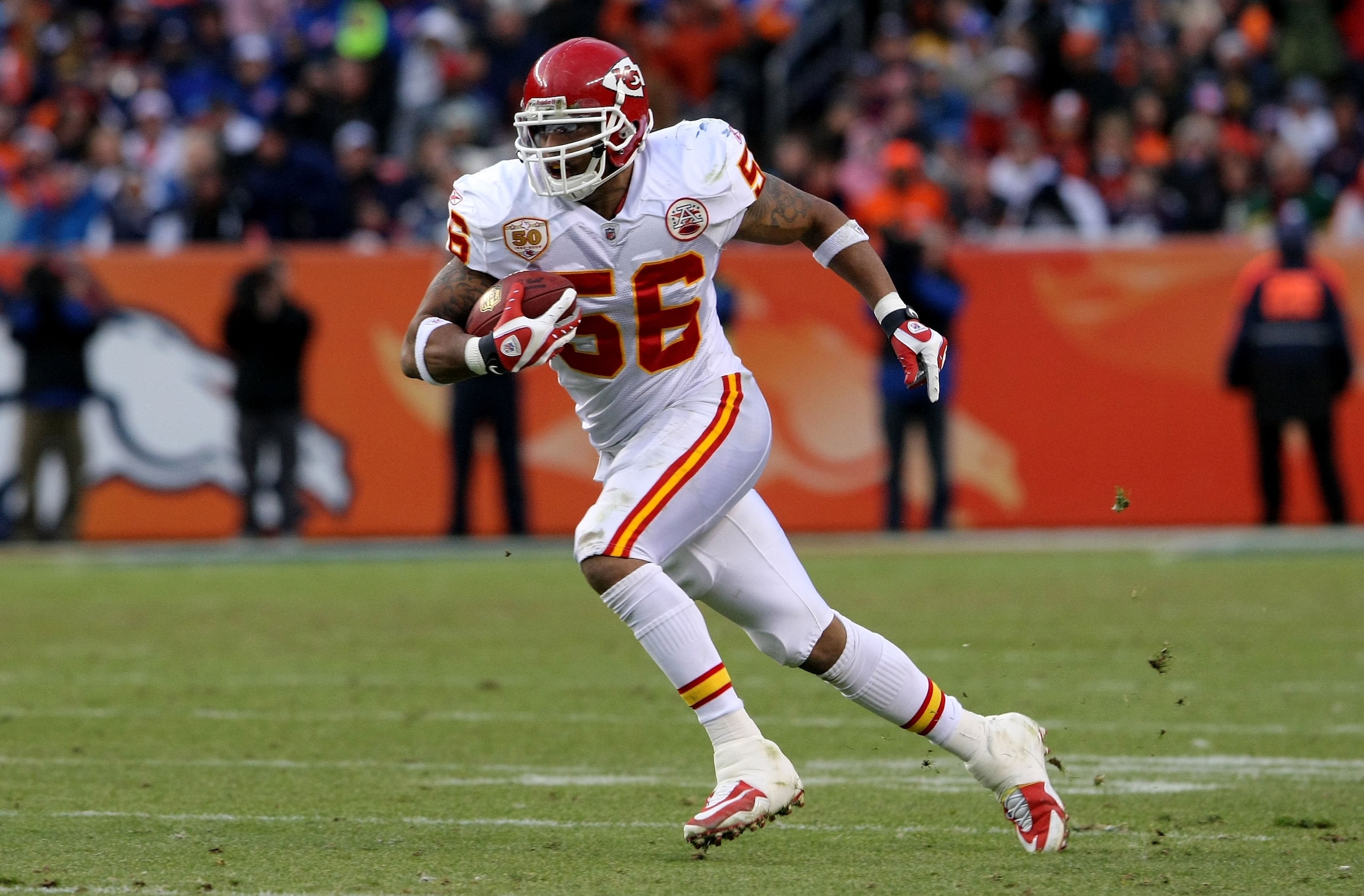 DENVER - JANUARY 03:  Linebacker Derrick Johnson #56 of the Kansas City Chiefs intercepts a pass by Kyle Orton of the Denver Broncos and returns it 45 yards for a touchdown to give the Chiefs a 27-17 lead in the third quarter during NFL action at Invesco