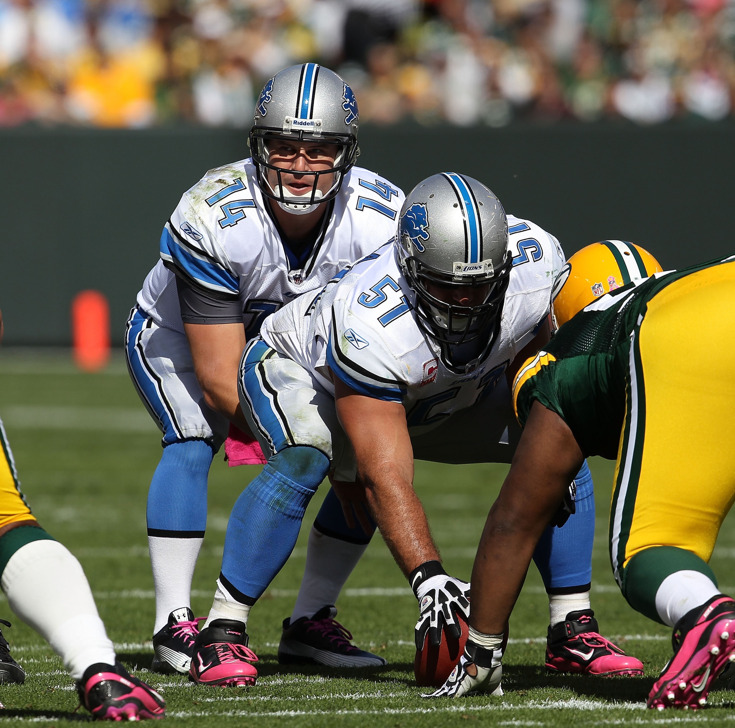GREEN BAY, WI - OCTOBER 03: Shaun Hill #14 of the Detroit Lions calls the signals as Dominic Raiola #51 waits to snap the ball against the Green Bay Packers at Lambeau Field on October 3, 2010 in Green Bay, Wisconsin. The Packers defeated the Lions 28-26.