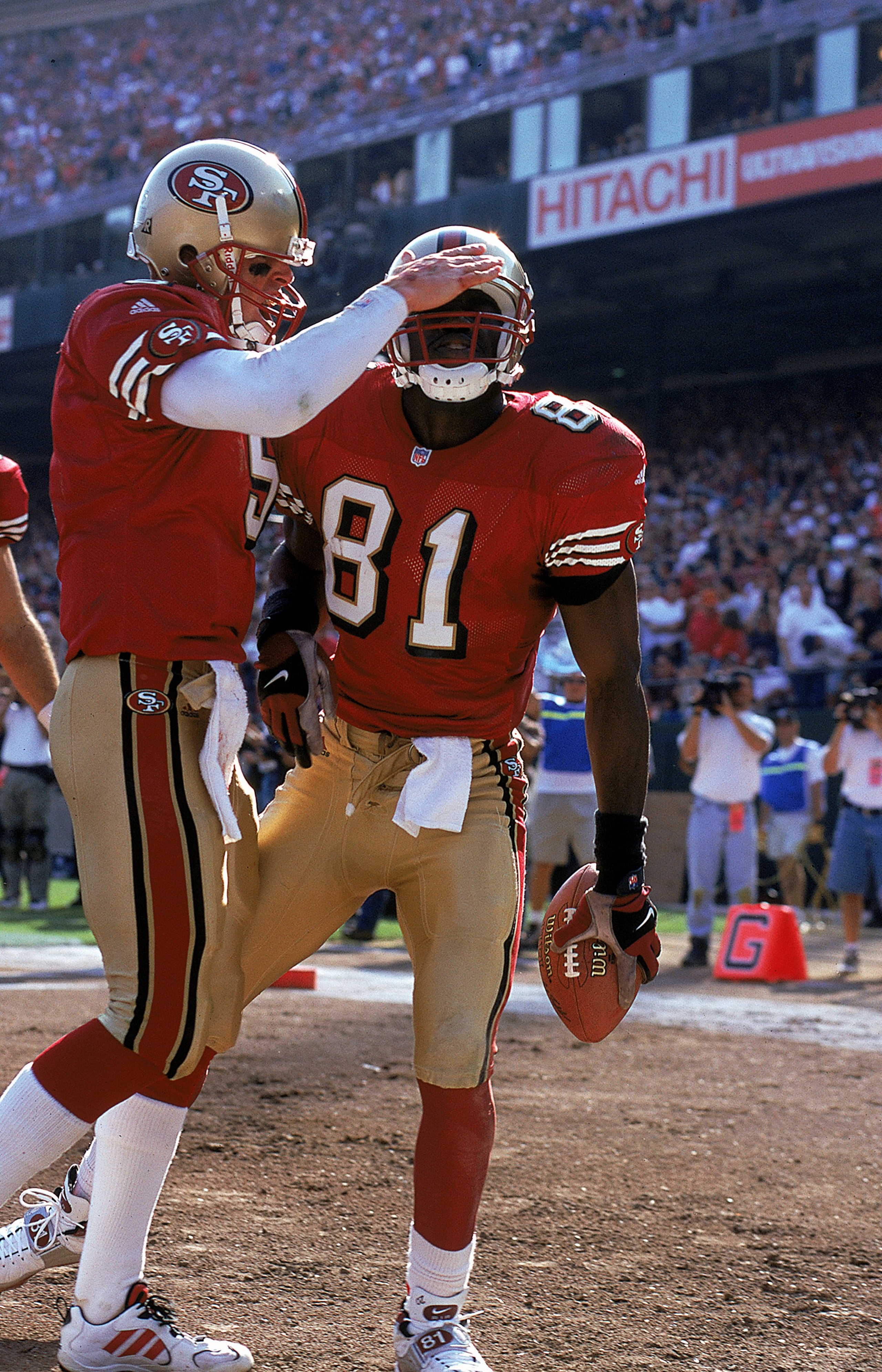 3 Oct 1999: Jeff Garcia #5 of the San Francisco 49ers celebrates with teammate Terrell Owens #81 during a game against the Tennessee Titans at the 3Com Park in San Francisco, California. The 49ers defeated the Titans 24-22. Mandatory Credit: Jed Jacobsohn