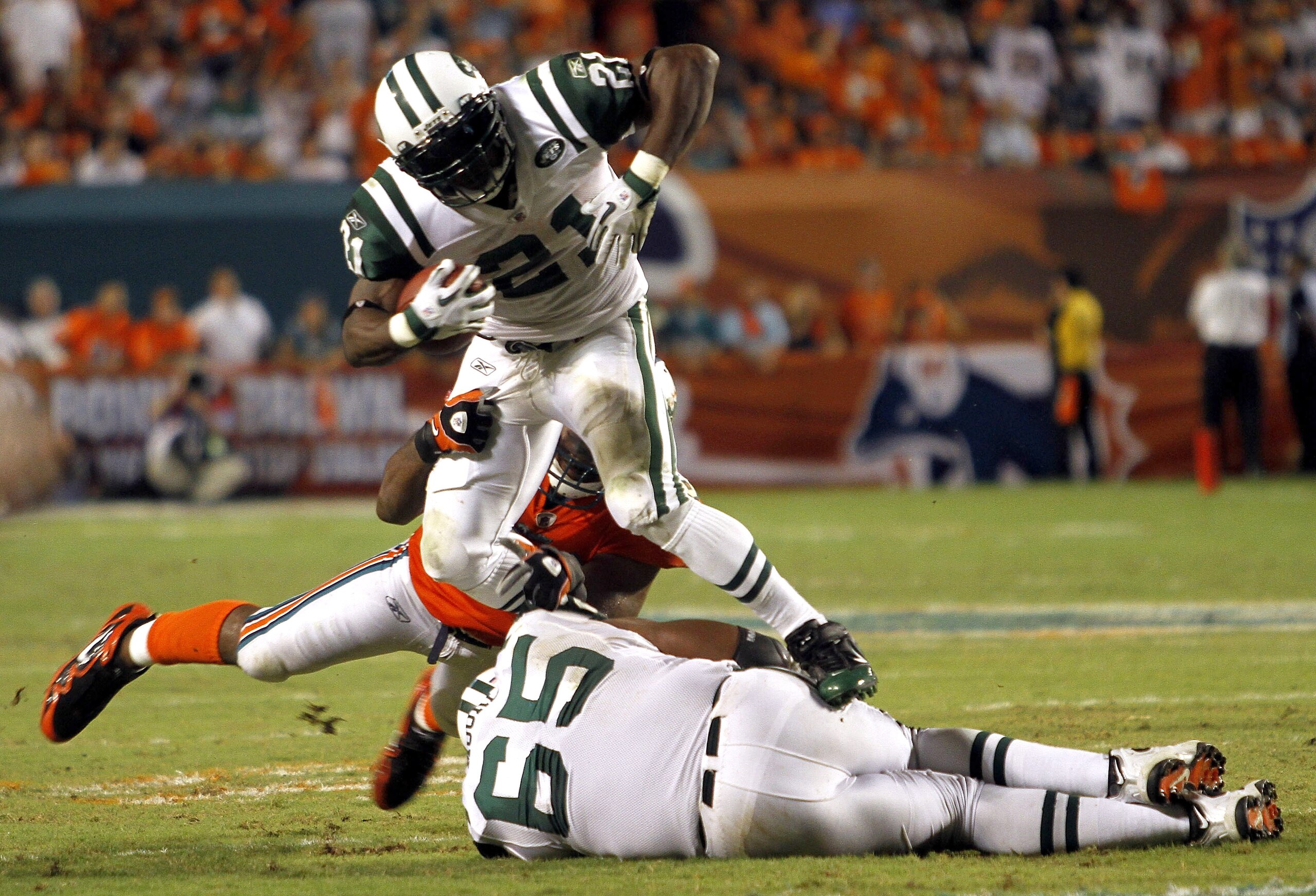 MIAMI - SEPTEMBER 26: Running back LaDanian Tomlinson #21 of the New York Jets runs against the Miami Dolphins at Sun Life Stadium on September 26, 2010 in Miami, Florida. The Jets won 31-23. (Photo by Marc Serota/Getty Images)