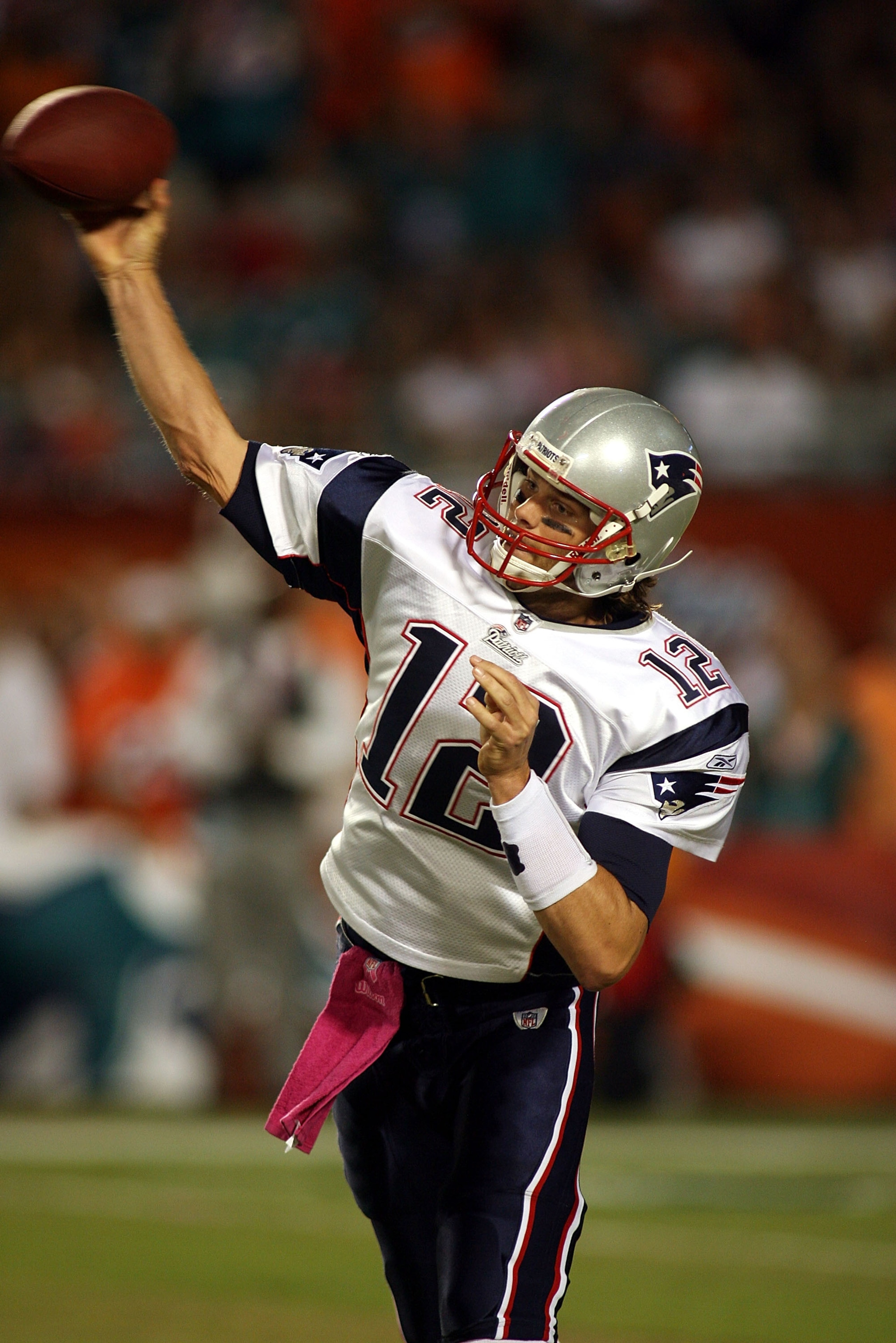 MIAMI - OCTOBER 04:  Quarterback Tom Brady #12 of the New England Patriots throws against the Miami Dolphins at Sun Life Stadium on October 4, 2010 in Miami, Florida.  (Photo by Marc Serota/Getty Images)