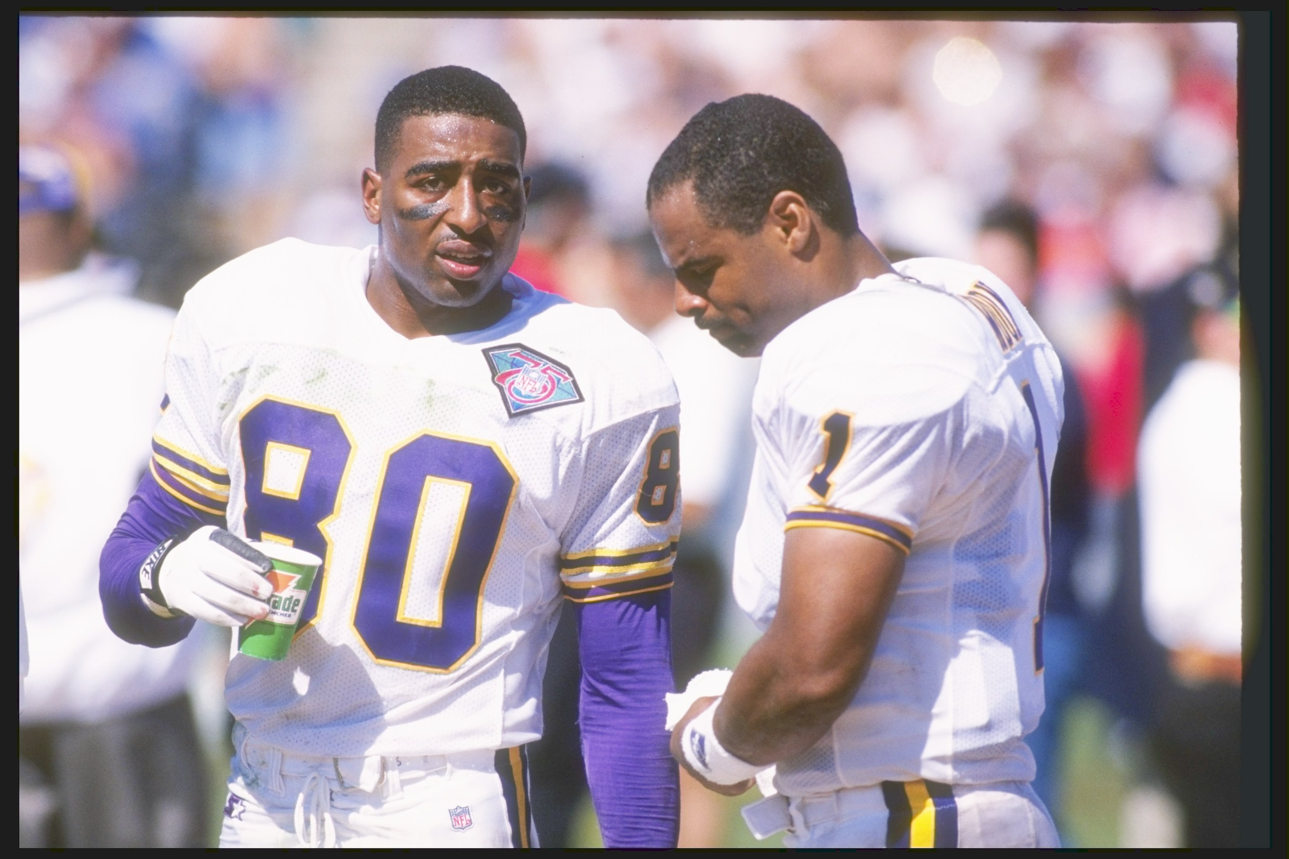 18 Sep 1994:  Wide receiver Cris Carter (left) and quarterback Warren Moon of the Minnesota Vikings speak on the sideline during a game against the Chicago Bears at Soldier Field in Chicago, Illinois.  The Vikings won the game 42-14. Mandatory Credit: Jon