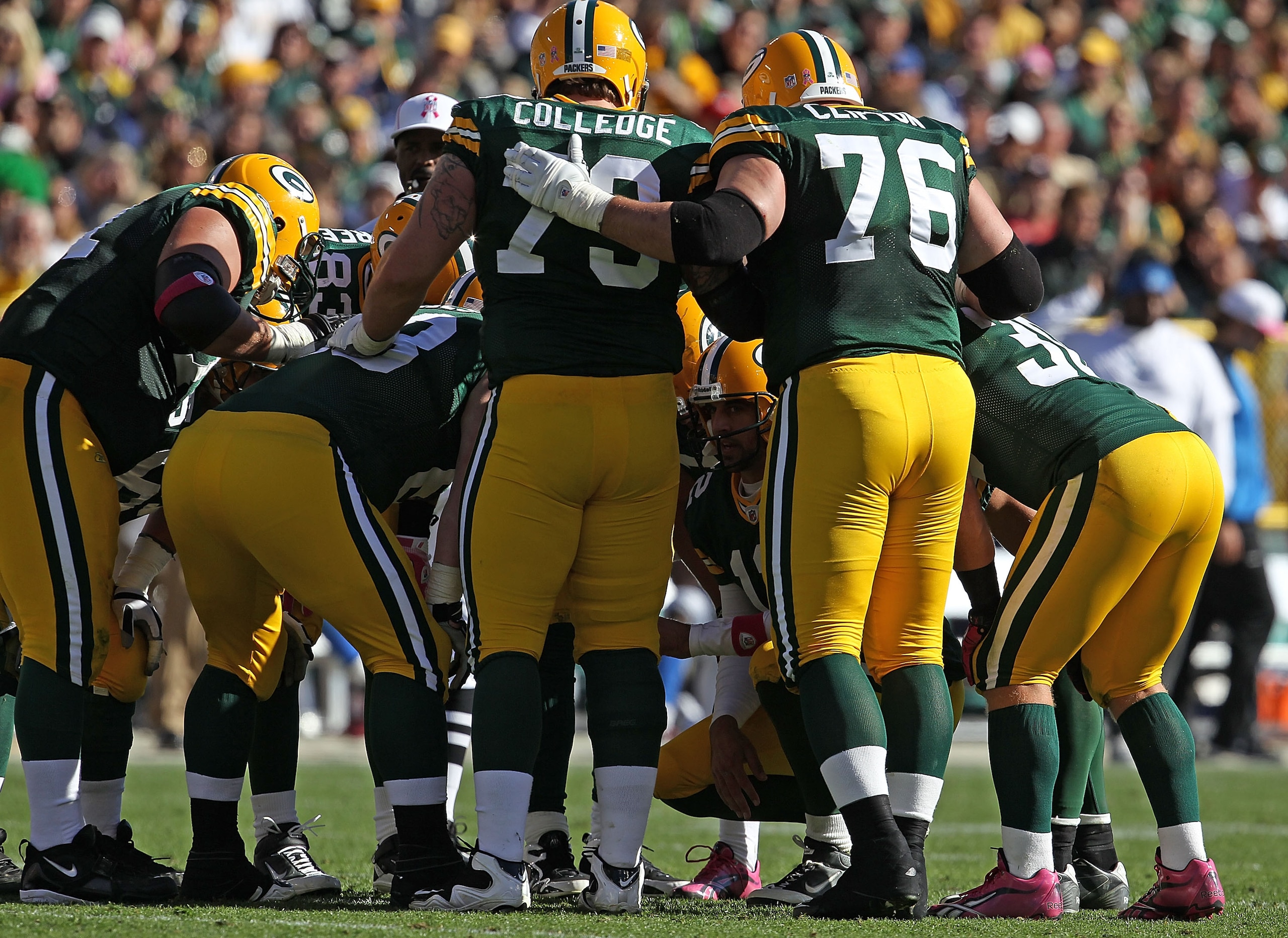 GREEN BAY, WI - OCTOBER 03: Aaron Rodgers #12 of the Green Bay Packers calls a play in the huddle against the Detroit Lions at Lambeau Field on October 3, 2010 in Green Bay, Wisconsin. The Packers defeated the Lions 28-26. (Photo by Jonathan Daniel/Getty