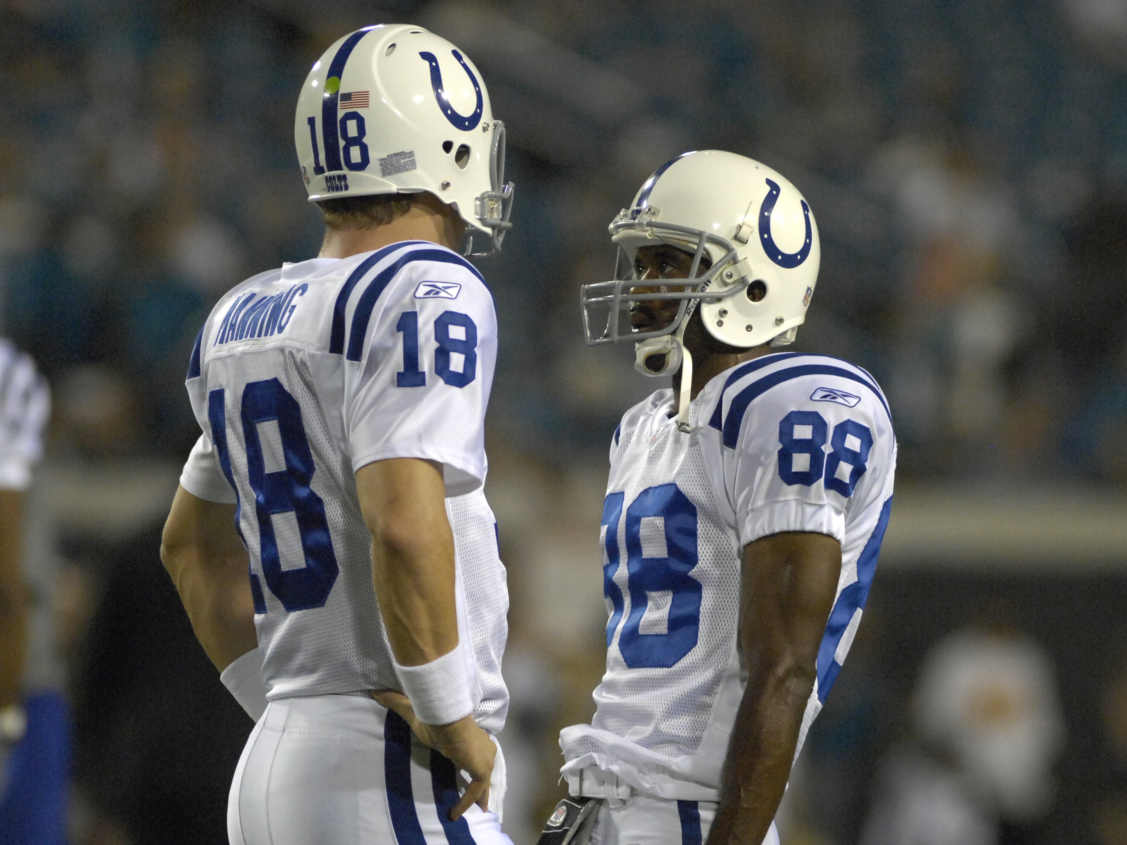 JACKSONVILLE, FL - OCTOBER 22: Quarterback Peyton Manning #18 and wide receiver Marvin Harrison #88 of the Indianapolis Colts meet at midfield during play against the Jacksonville Jaguars at the Jacksonville Municipal Stadium on October 22, 2007 in Jackso