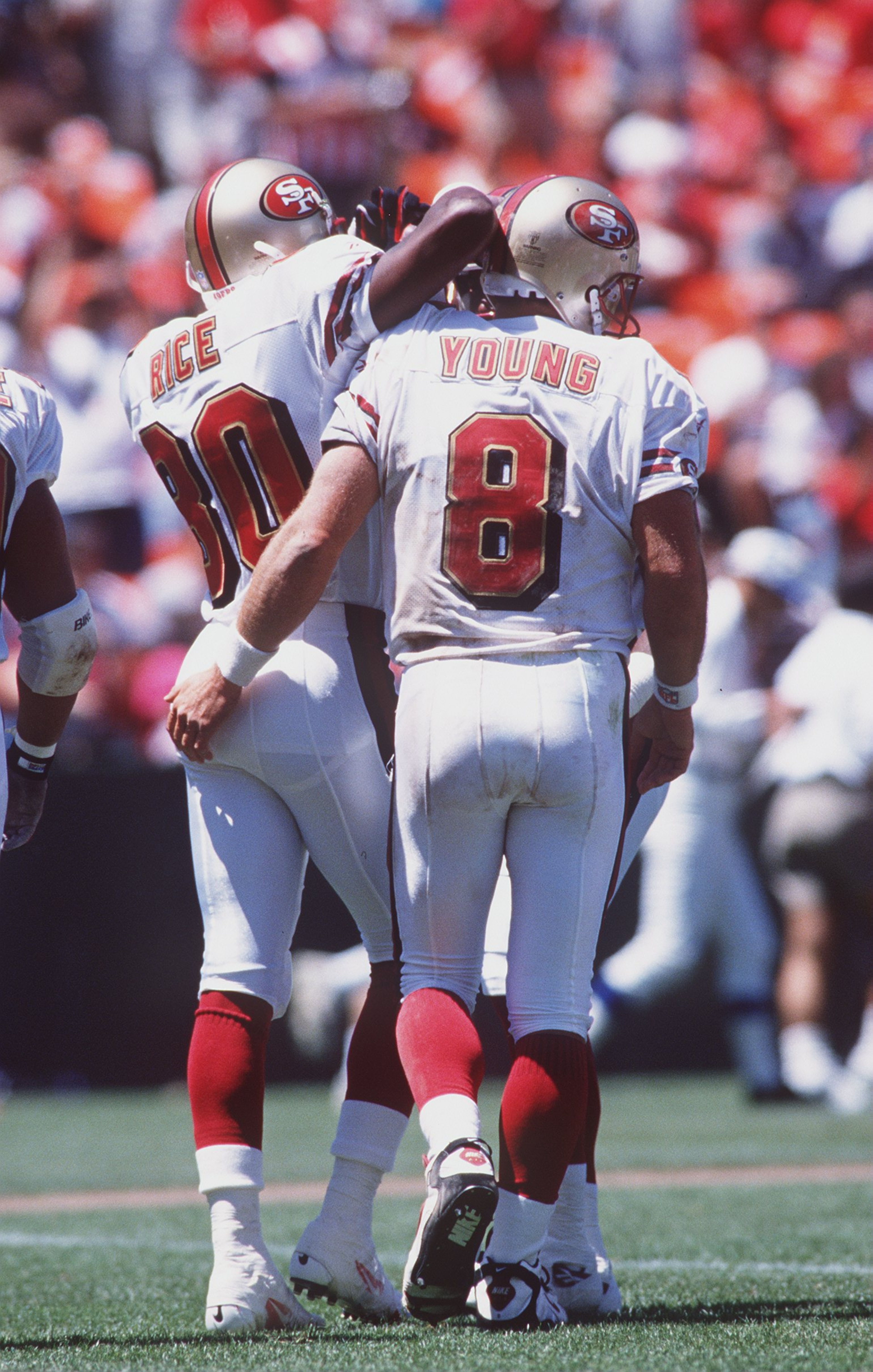 3 Aug 1996: Quarterback Steve Young of the San Francisco is congratulated by wide receiver Jerry Rice during the 49ers 20-17 loss to the Denver Broncos at 3Com Park in San Francisco, California.