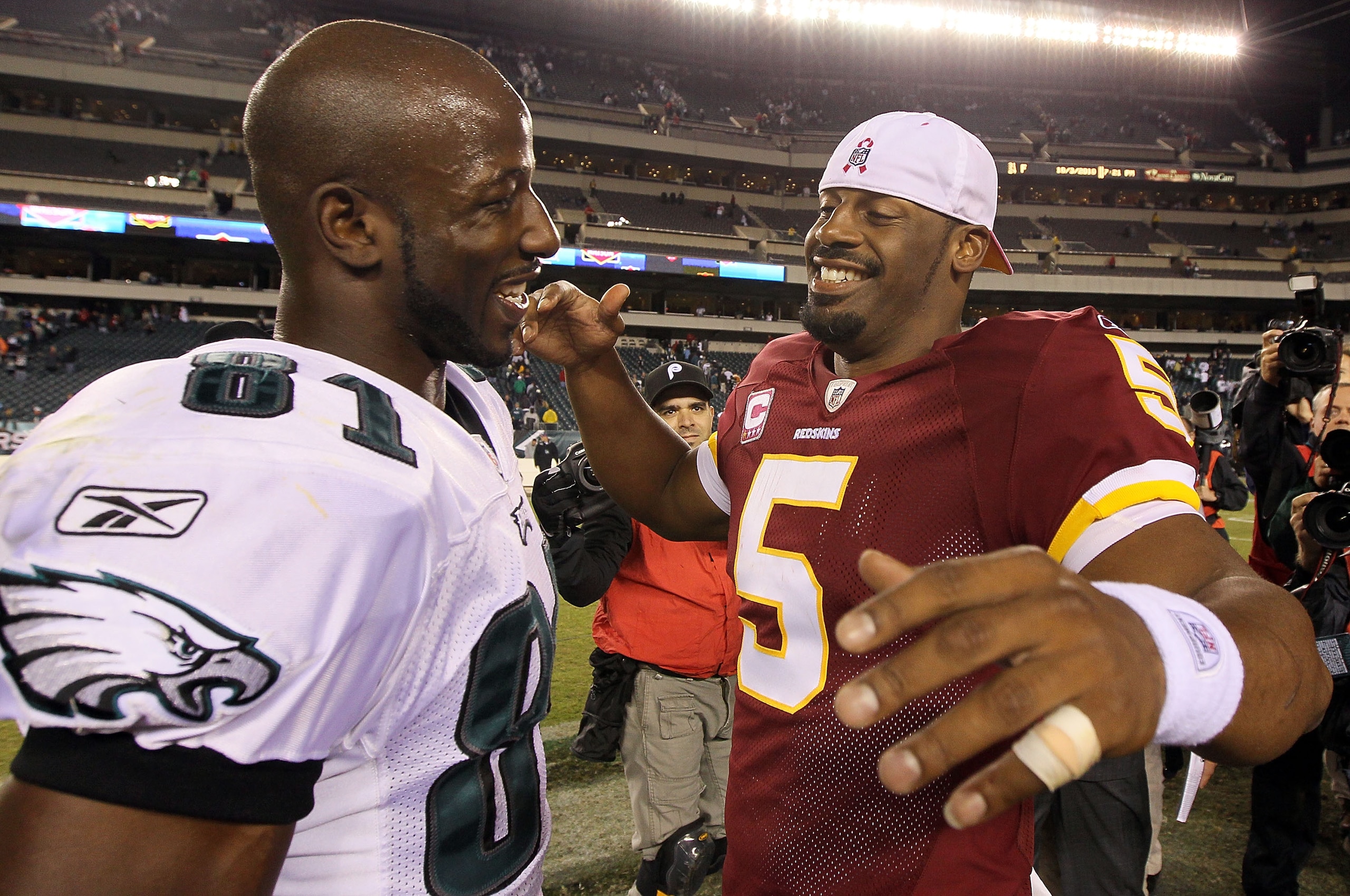 PHILADELPHIA - OCTOBER 03:  Donovan McNabb #5 of the Washington Redskins meets with Jason Avant #81 of the Philadelphia Eagles after their game on October 3, 2010 at Lincoln Financial Field in Philadelphia, Pennsylvania. The Redskins defeated the Eagles 1