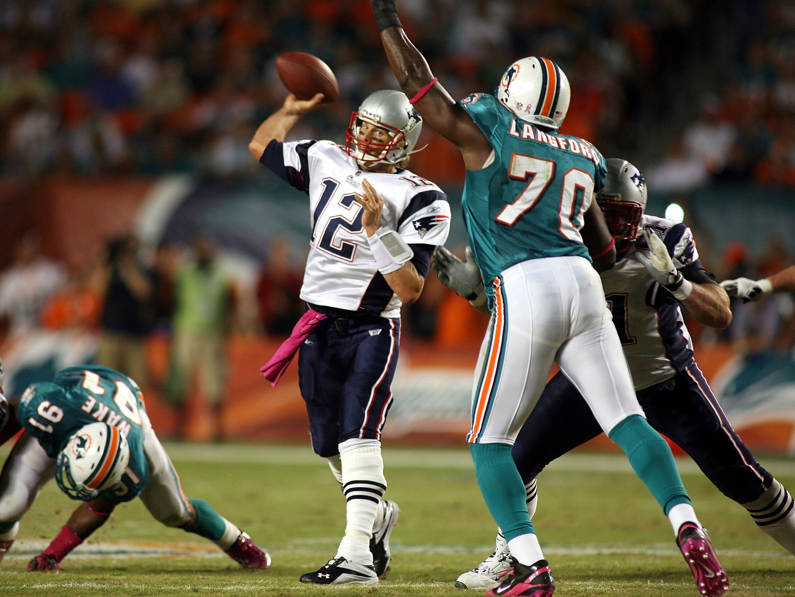 MIAMI - OCTOBER 04:  Quarterback Tom Brady #12 of the New England Patriots throws against the Miami Dolphins at Sun Life Stadium on October 4, 2010 in Miami, Florida.  (Photo by Marc Serota/Getty Images)