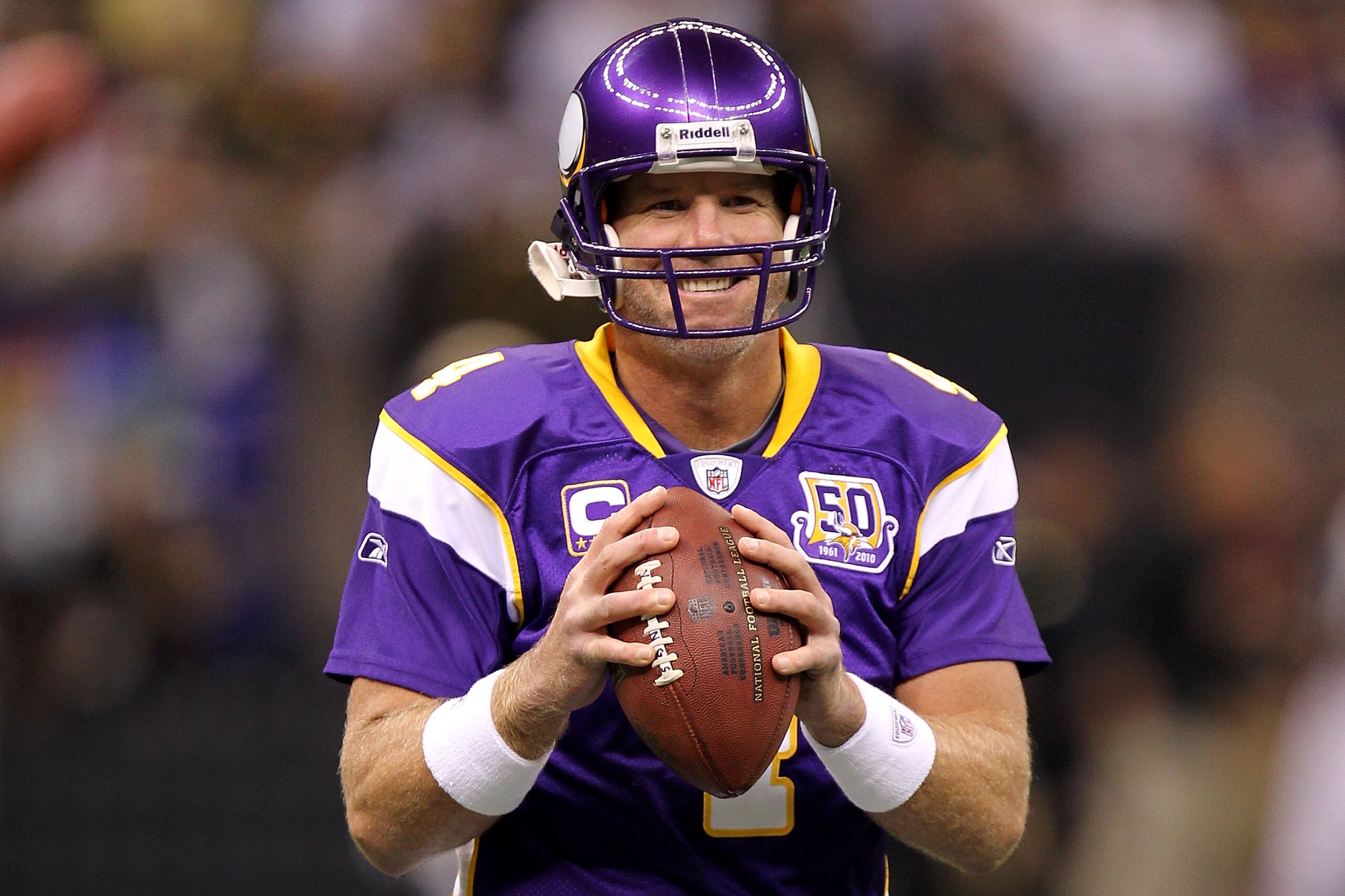 NEW ORLEANS - SEPTEMBER 09:  Quarterback Brett Favre #4 of the Minnesota Vikings smiles as he warms up against the New Orleans Saints at Louisiana Superdome on September 9, 2010 in New Orleans, Louisiana.  (Photo by Ronald Martinez/Getty Images)