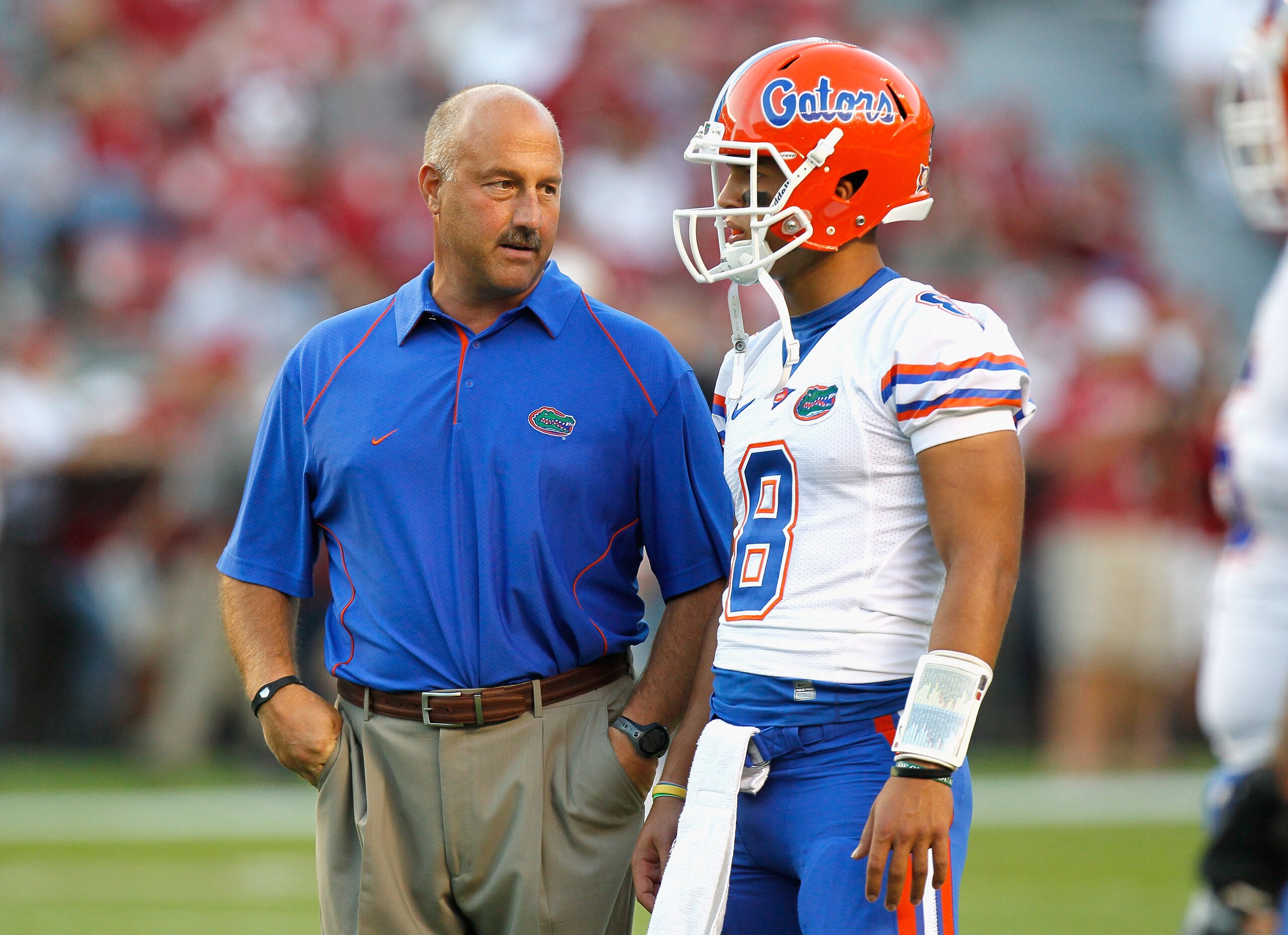 TUSCALOOSA, AL - OCTOBER 02:  Offensive coordinator Steve Addazio converses with quarterback Trey Burton #8 of the Florida Gators during pregame warmups before facing the Alabama Crimson Tide at Bryant-Denny Stadium on October 2, 2010 in Tuscaloosa, Alaba