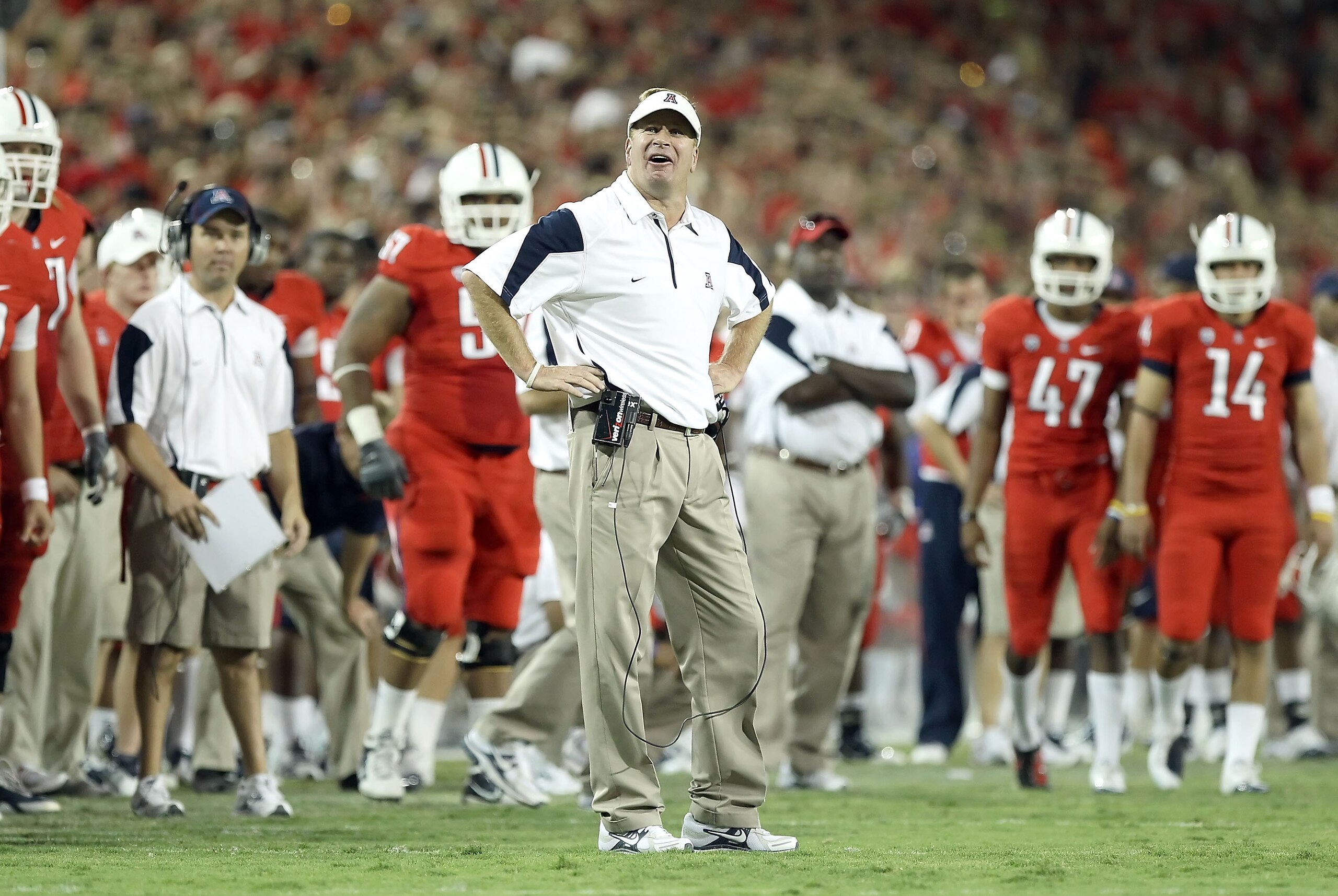 TUCSON, AZ - SEPTEMBER 18: Head coach Mike Stoops of the Arizona Wildcats reacts during the college football game against the Iowa Hawkeyes at Arizona Stadium on September 18, 2010 in Tucson, Arizona. The Wildcats defeated the Hawkeyes 34-27. (Photo by TUCSON, AZ - SEPTEMBER 18: Head coach Mike Stoops of the Arizona Wildcats reacts during the college football game against the Iowa Hawkeyes at Arizona Stadium on September 18, 2010 in Tucson, Arizona. The Wildcats defeated the Hawkeyes 34-27. (Photo by
