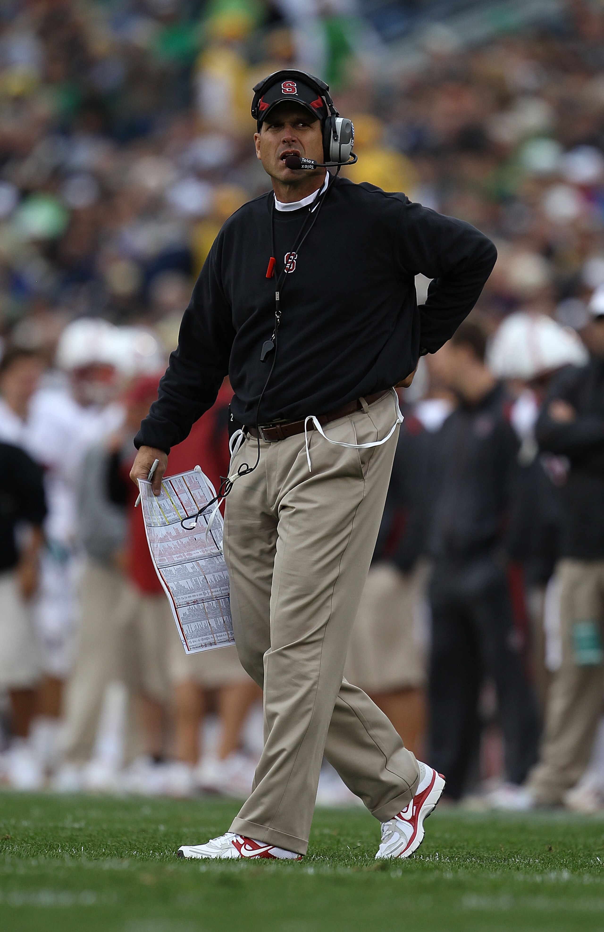 SOUTH BEND, IN - SEPTEMBER 25: Head coach Jim Harbaugh of the Stanford Cardinal looks at the scoreboard during a time out against the Notre Dame Fighting Irish at Notre Dame Stadium on September 25, 2010 in South Bend, Indiana. Stanford defeated Notre Dam SOUTH BEND, IN - SEPTEMBER 25: Head coach Jim Harbaugh of the Stanford Cardinal looks at the scoreboard during a time out against the Notre Dame Fighting Irish at Notre Dame Stadium on September 25, 2010 in South Bend, Indiana. Stanford defeated Notre Dam