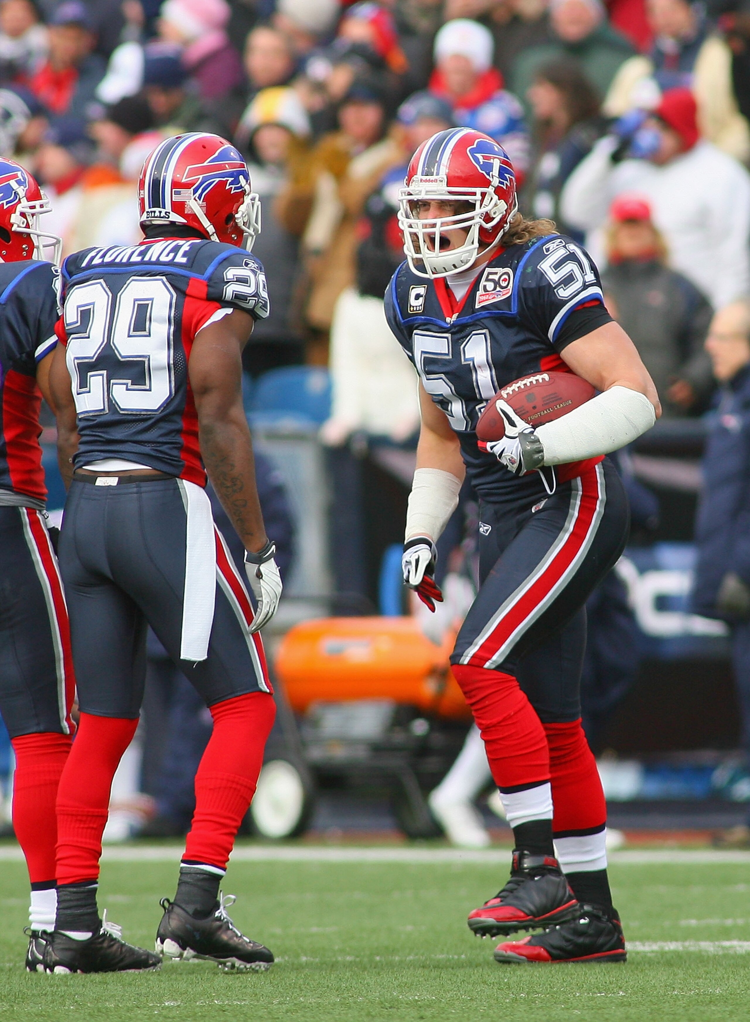 ORCHARD PARK, NY - DECEMBER 20:  Paul Posluszny #51 and Drayton Florence #29 of the Buffalo Bills celebrate Posluszny's interception against the New England Patriots at Ralph Wilson Stadium on December 20, 2009 in Orchard Park, New York.  (Photo by Rick S