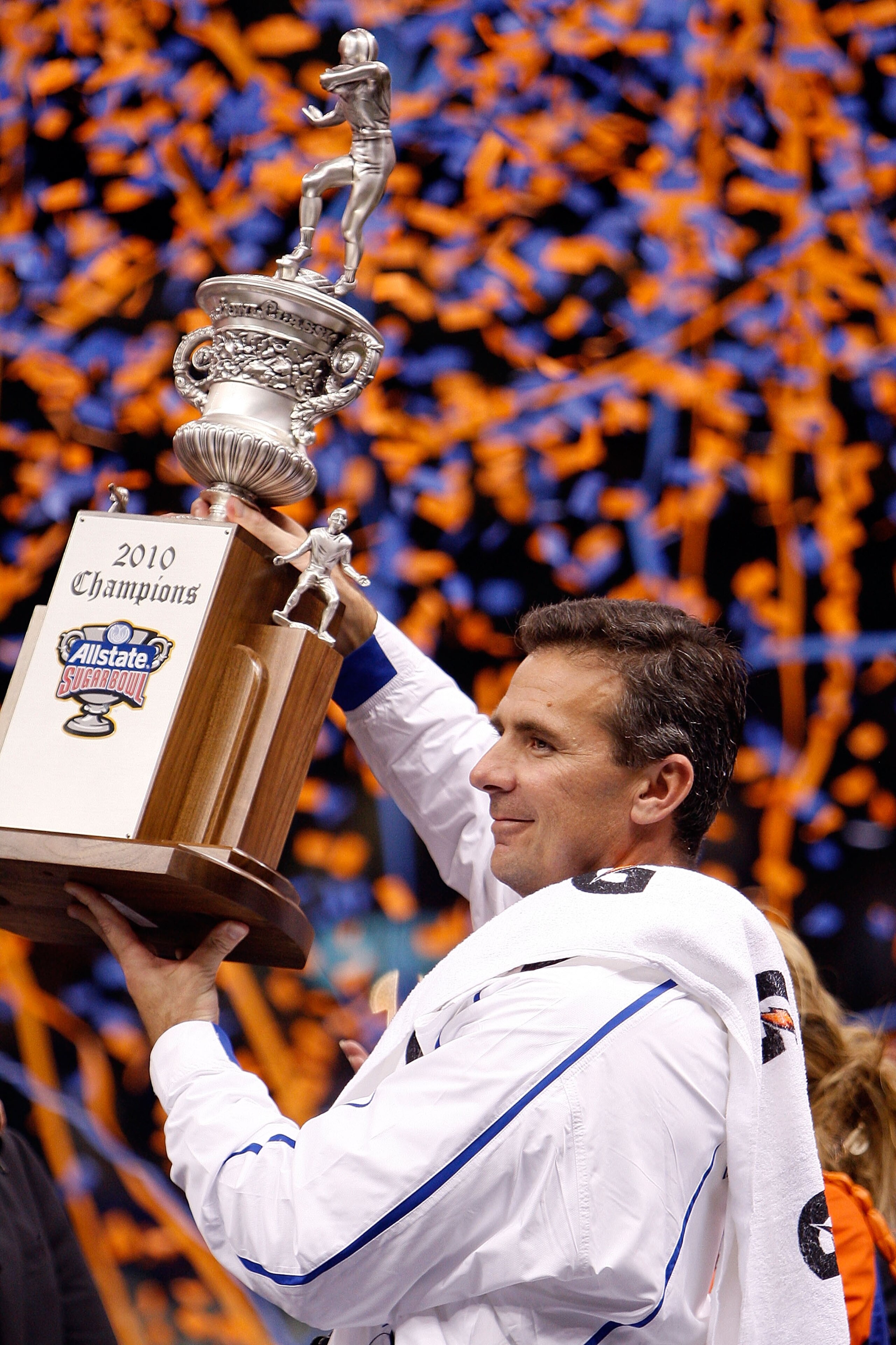 NEW ORLEANS - JANUARY 01:  Head coach Urban Meyer of the Florida Gators hoist the trophy after the Gators defeated the Bearcats 24-51 in the Allstate Sugar Bowl at the Louisana Superdome on January 1, 2010 in New Orleans, Louisiana.  (Photo by Chris Grayt