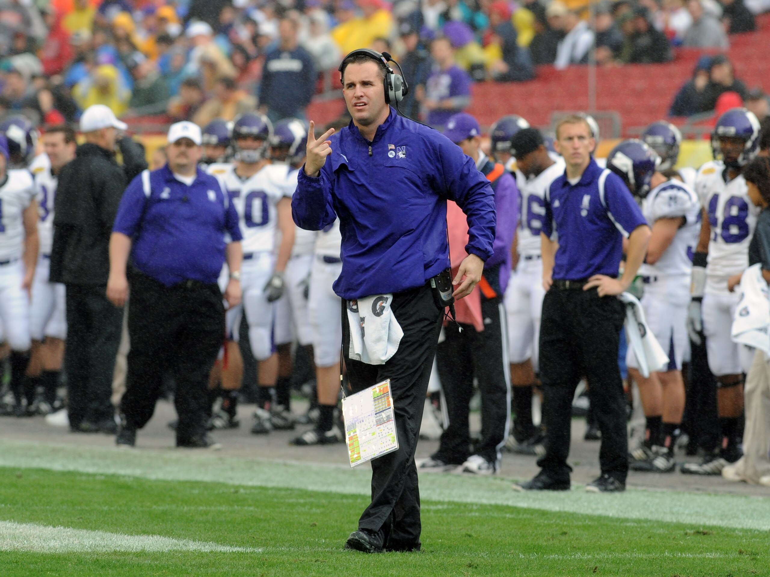 TAMPA, FL - JANUARY 1: Coach Pat Fitzgerald of the Northwestern Wildcats directs play against the Auburn Tigers in the Outback Bowl January 1, 2010 at Raymond James Stadium in Tampa, Florida. (Photo by Al Messerschmidt/Getty Images) TAMPA, FL - JANUARY 1: Coach Pat Fitzgerald of the Northwestern Wildcats directs play against the Auburn Tigers in the Outback Bowl January 1, 2010 at Raymond James Stadium in Tampa, Florida. (Photo by Al Messerschmidt/Getty Images)