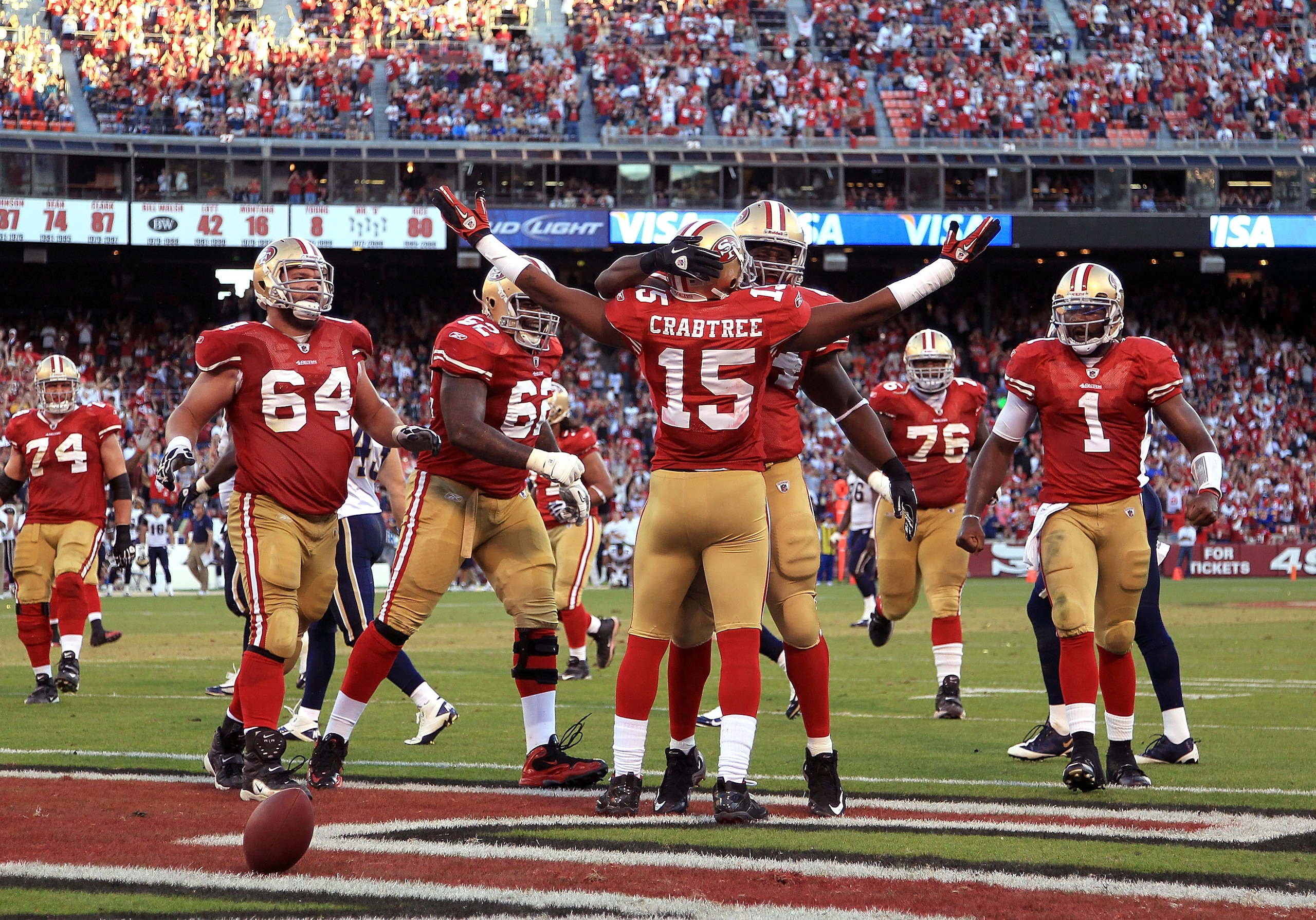 SAN FRANCISCO - NOVEMBER 14:  Michael Crabtree #15 of the San Francisco 49ers is congratulated by teammates after scoring a touchdown against the St. Louis Rams at Candlestick Park on November 14, 2010 in San Francisco, California.  (Photo by Ezra Shaw/Ge