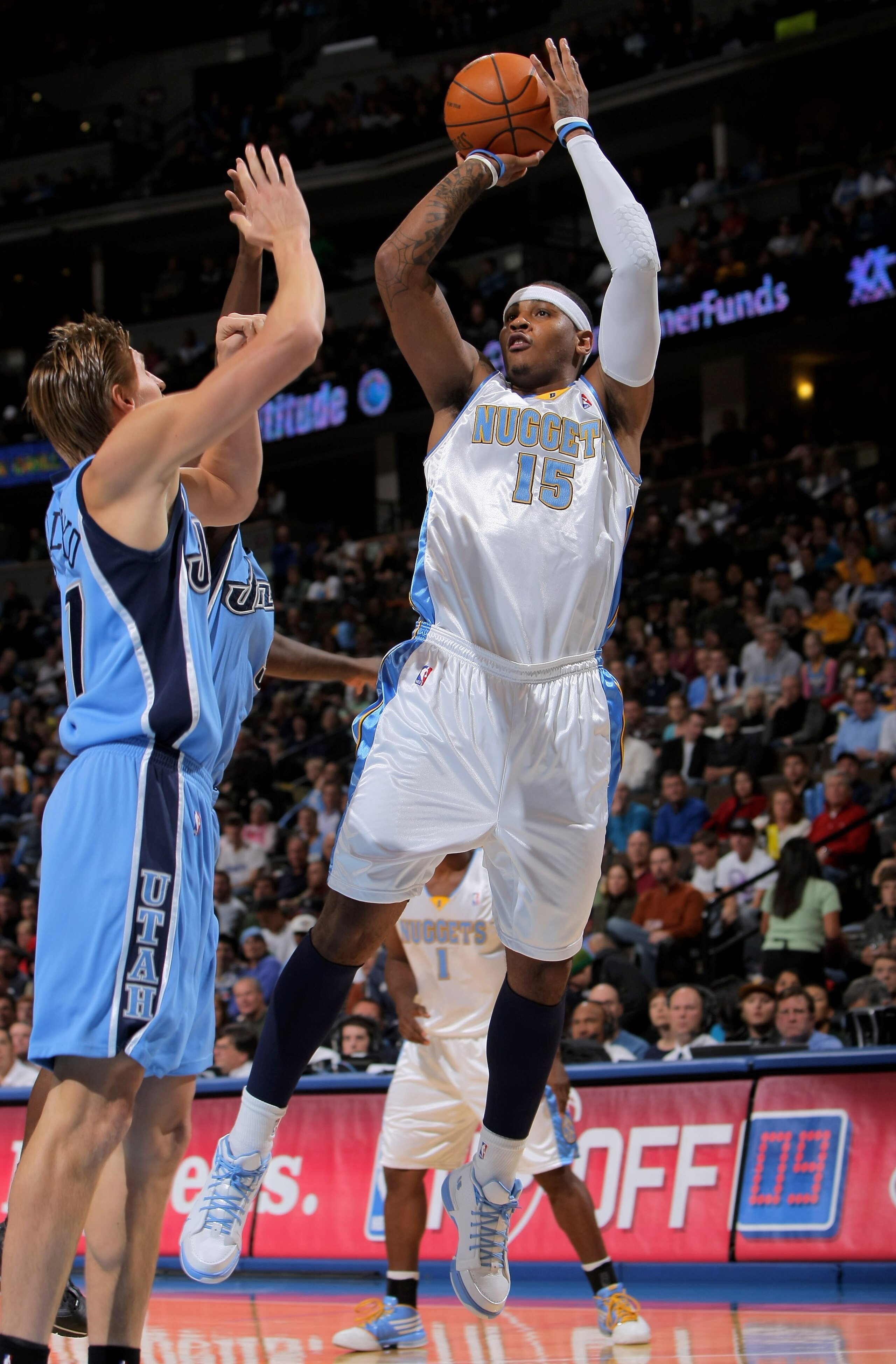 DENVER - OCTOBER 28:  Carmelo Anthony #15 of the Denver Nuggets takes a shot over Andrei Kirilenko #47 of the Utah Jazz during NBA action at Pepsi Center on October 28, 2009 in Denver, Colorado.  (Photo by Doug Pensinger/Getty Images)