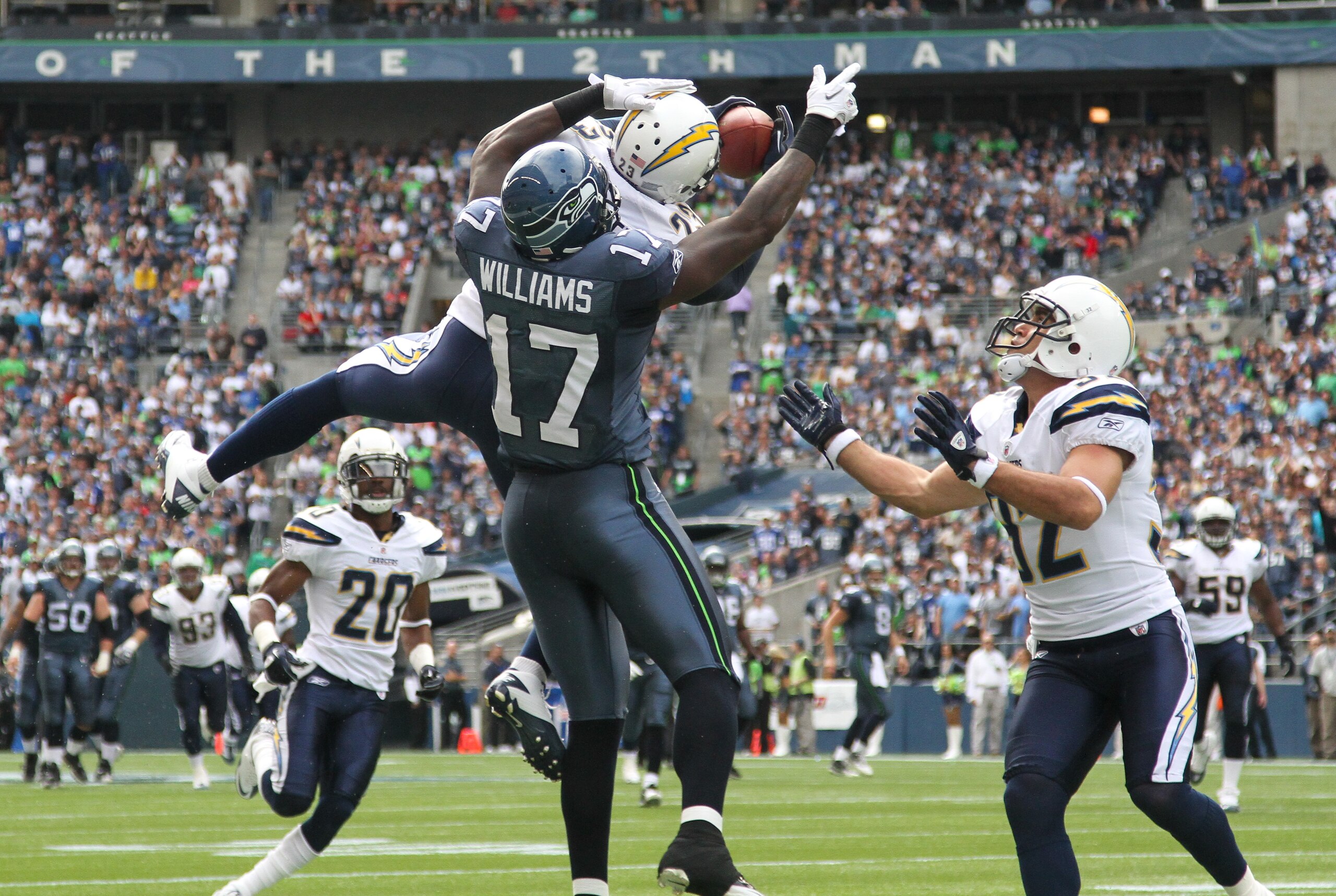 SEATTLE - SEPTEMBER 26:  Cornerback Quentin Jammer #23 of the San Diego Chargers intercepts a pass against Mike Williams #17 of the Seattle Seahawks at Qwest Field on September 26, 2010 in Seattle, Washington. (Photo by Otto Greule Jr/Getty Images)
