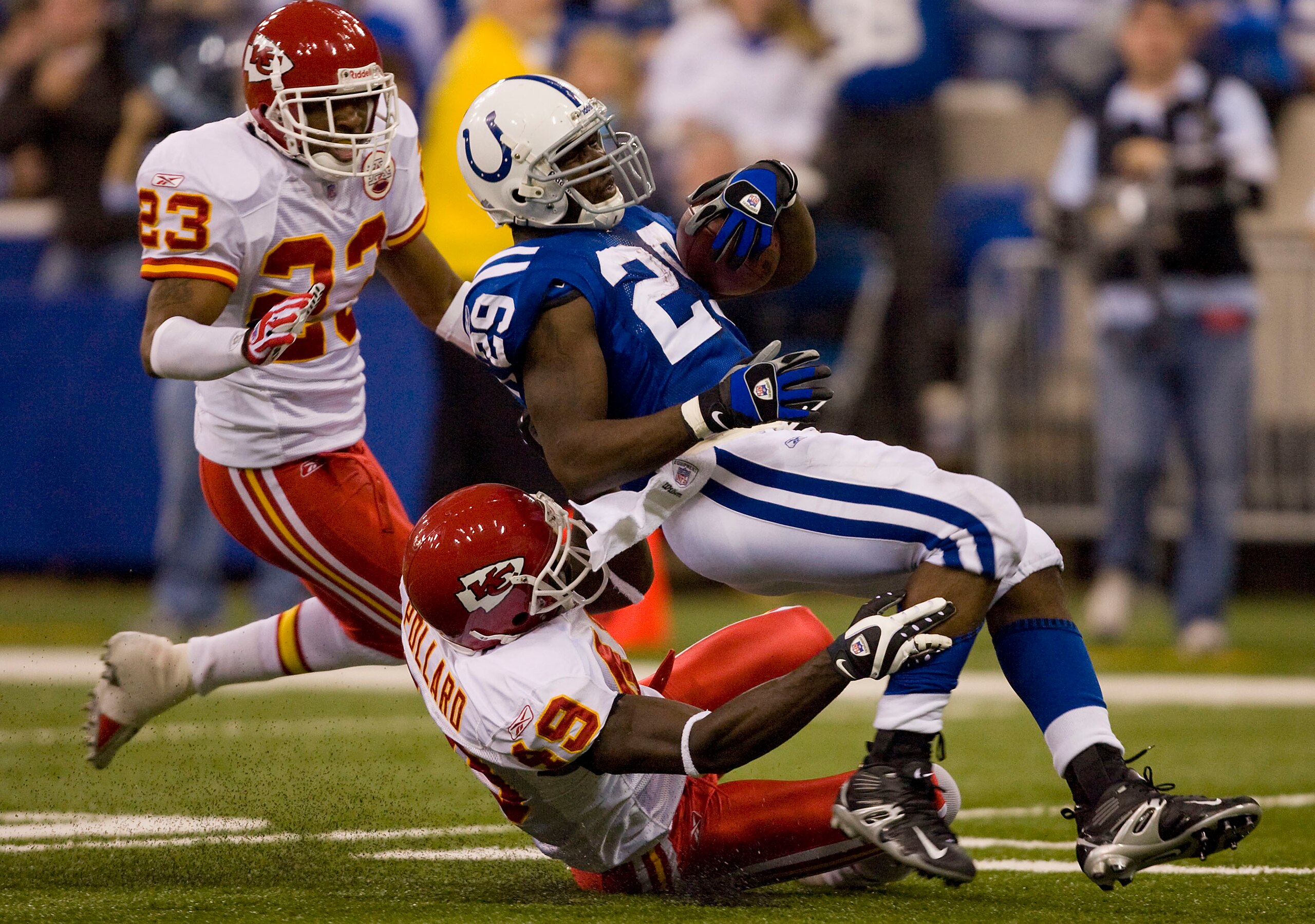 INDIANAPOLIS - NOVEMBER 18:  Joseph Addai #29 of the Indianapolis Colts is tackled by Bernard Pollard #49 of the Kansas City Chiefs on November 18, 2007 at the RCA Dome in Indianapolis, Indiana. The Colts defeated the Chiefs 13-10.  (Photo by Dilip Vishwa