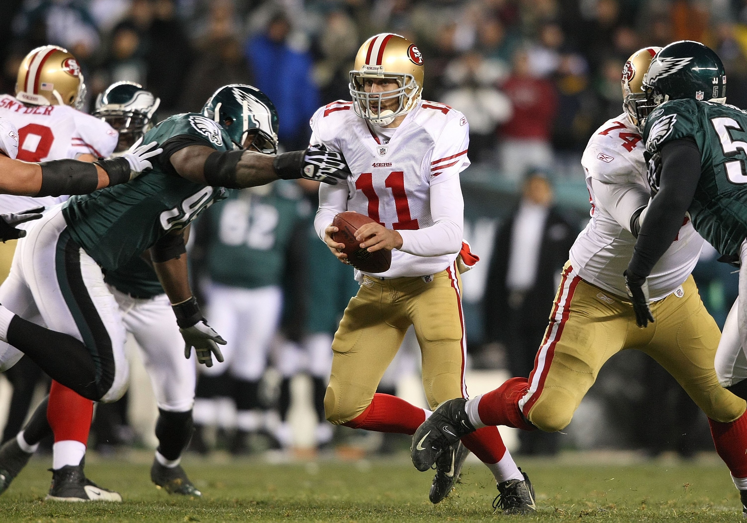 PHILADELPHIA - DECEMBER 20:  Alex Smith #11 of the San Francisco 49ers runs against the Philadelphia Eagles at Lincoln Financial Field on December 20, 2009 in Philadelphia, Pennsylvania.  (Photo by Nick Laham/Getty Images)