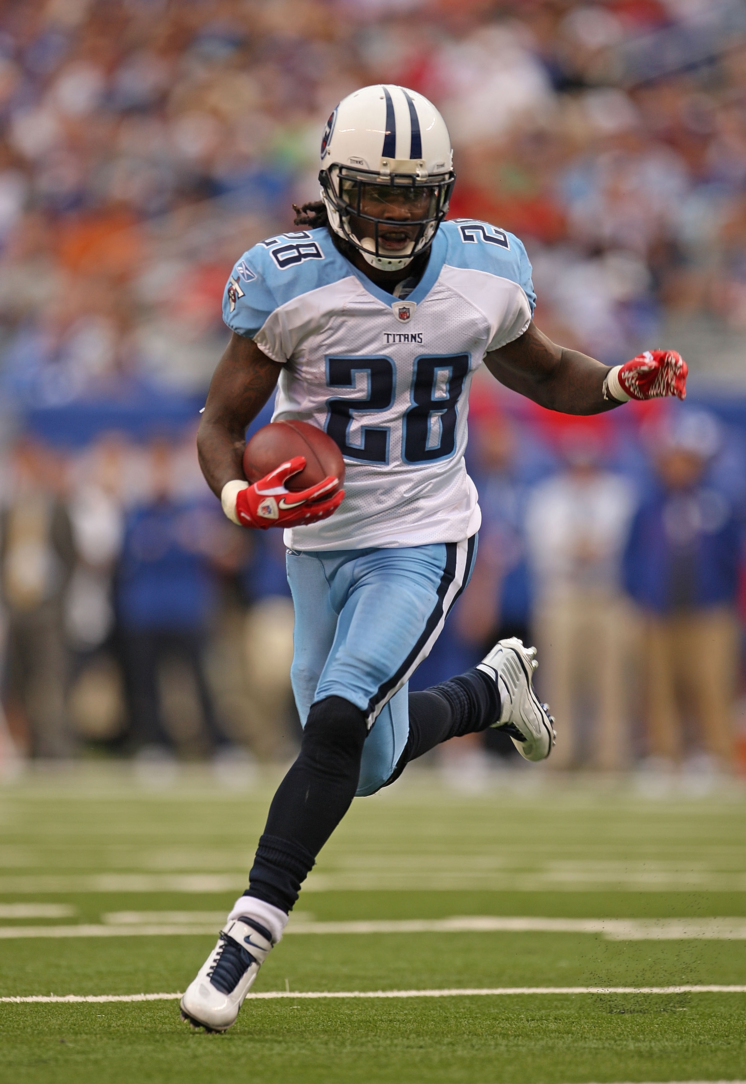 EAST RUTHERFORD, NJ - SEPTEMBER 26:  Chris Johnson #28 of the Tennessee Titans rushes during a game against the New York Giants at New Meadowlands Stadium on September 26, 2010 in East Rutherford, New Jersey.  (Photo by Mike Ehrmann/Getty Images)