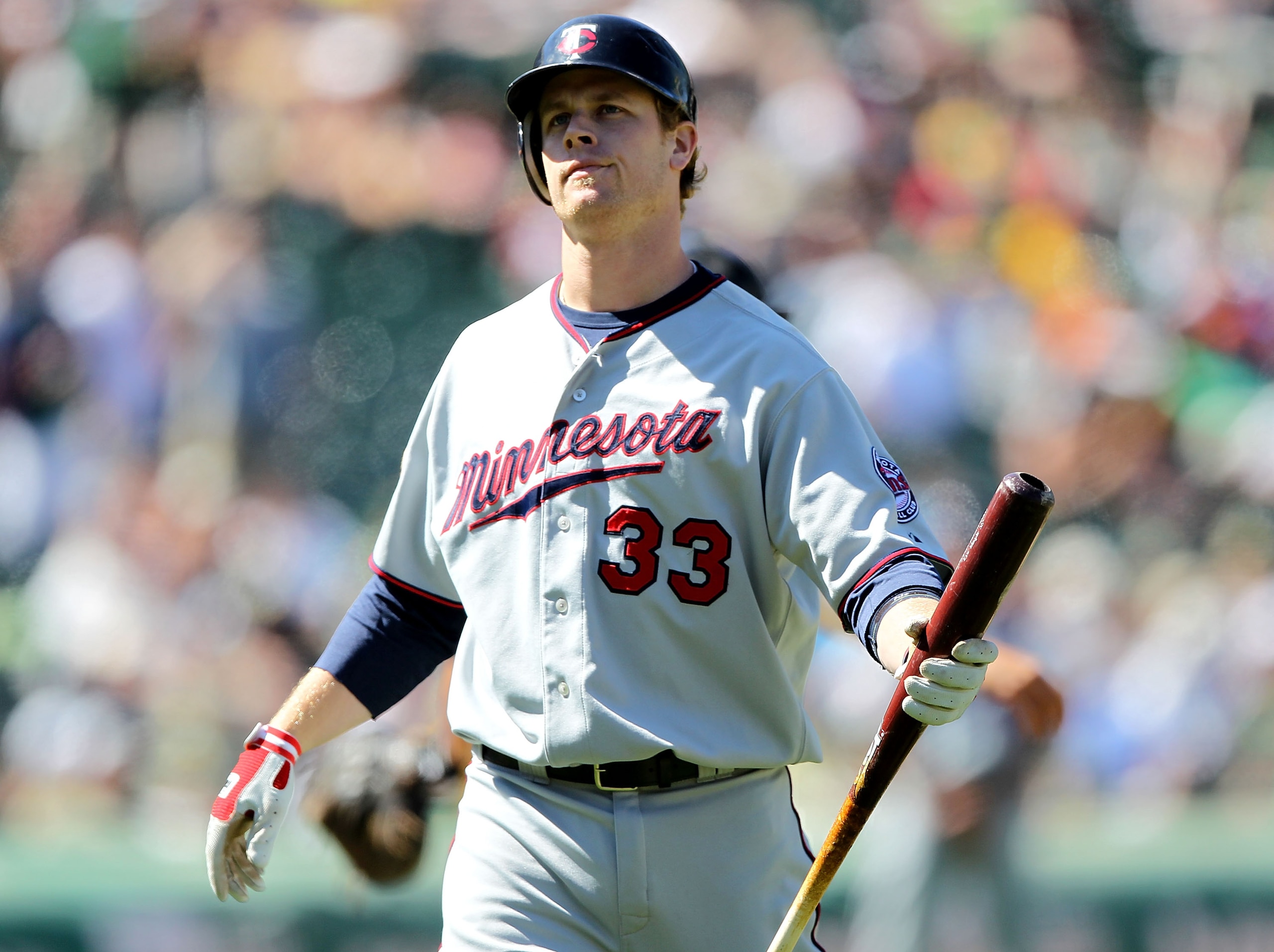 OAKLAND, CA - JUNE 06: Justin Morneau #33 of the Minnesota Twins reacts after striking out in the ninth inning against the Oakland Athletics during an MLB game at the Oakland-Alameda County Coliseum on June 6, 2010 in Oakland, California.  (Photo by Jed J