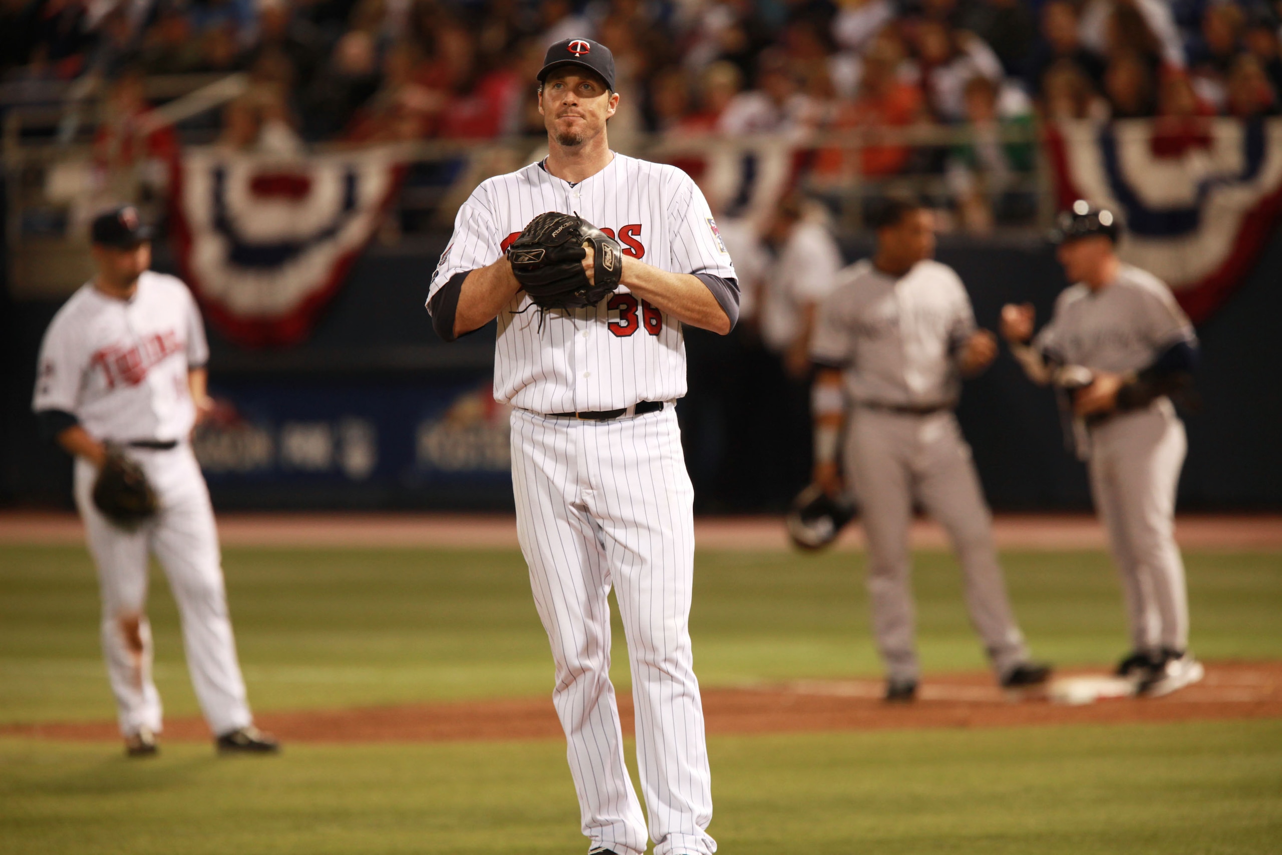 MINNEAPOLIS, MN - OCTOBER 11: Pitcher Joe Nathan #36 of the Minnesota Twins sighs after Alex Rodriguez #13 of the New York Yankees scored in the ninth inning on a Robinson Cano #24 of the Yankees single RBI in Game Three of the ALDS during the 2009 MLB Pl