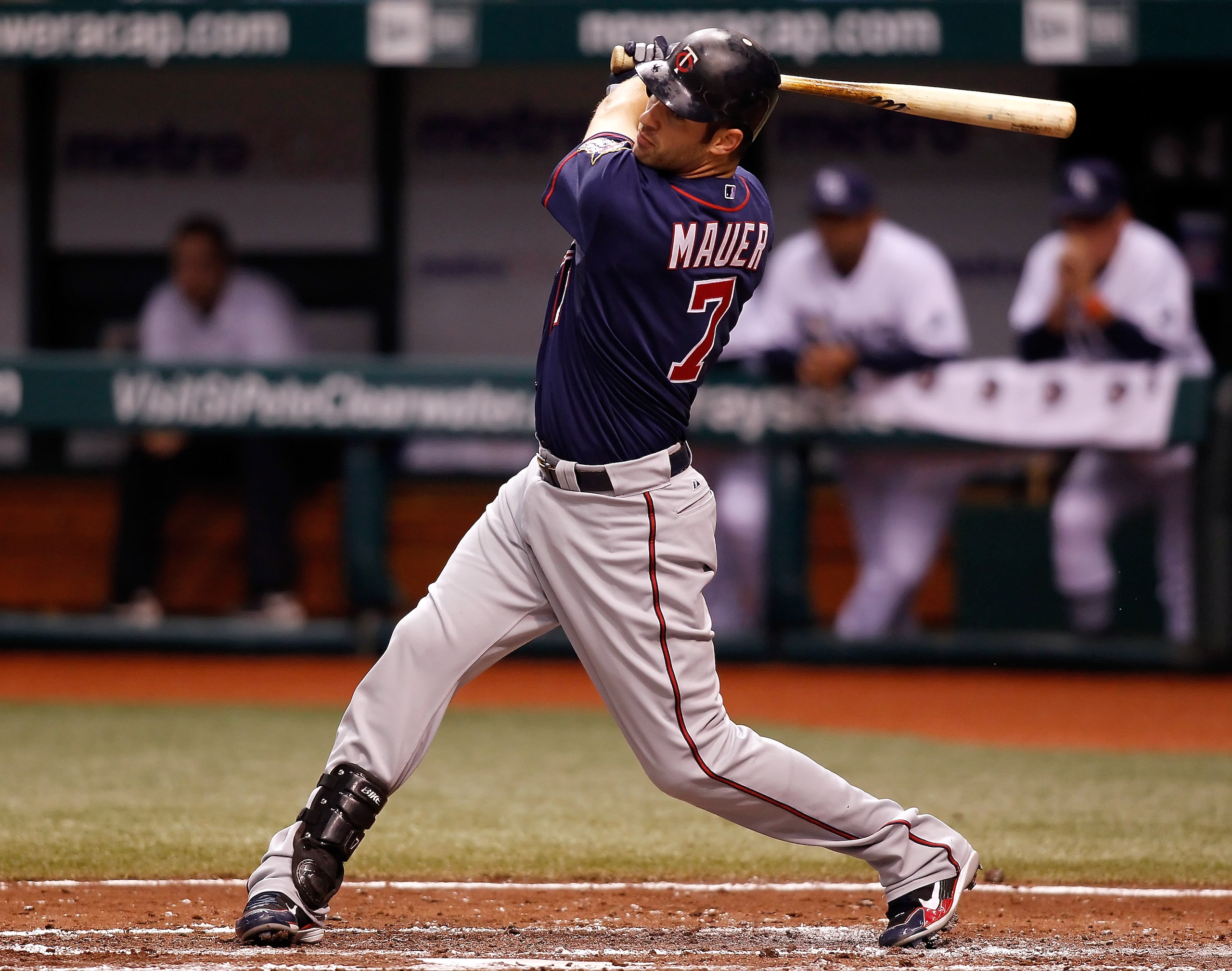 ST. PETERSBURG - AUGUST 04:  Designated hitter Joe Mauer #7 of the Minnesota Twins fouls off a pitch against the Tampa Bay Rays during the game at Tropicana Field on August 4, 2010 in St. Petersburg, Florida.  (Photo by J. Meric/Getty Images)
