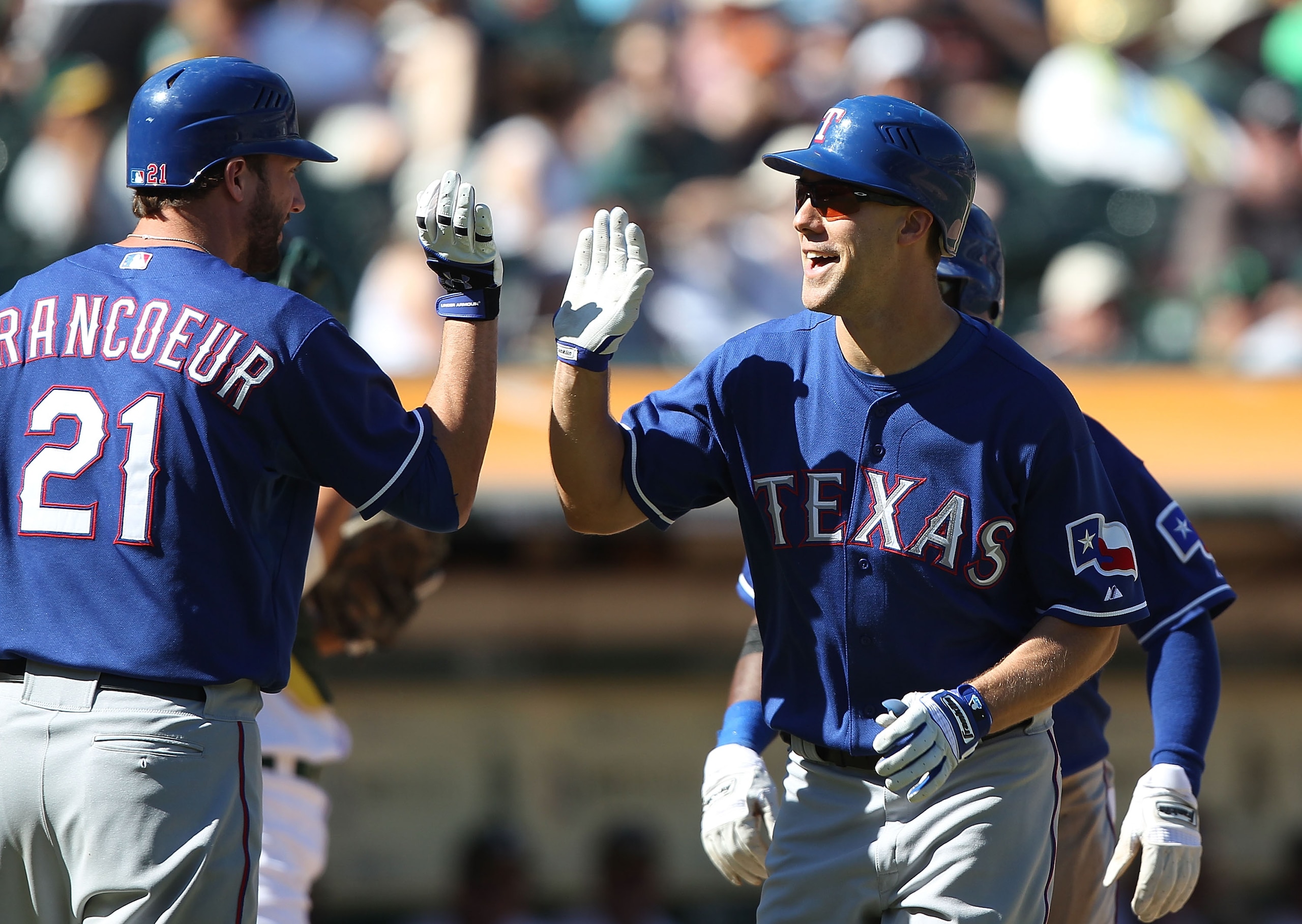 OAKLAND, CA - SEPTEMBER 26: David Murphy #7 of the Texas Rangers celebrates with Jeff Francoeur after hitting a home run against the Oakland Athletics during a Major League Baseball game at the Oakland-Alameda County Coliseum on September 26, 2010 in Oakl